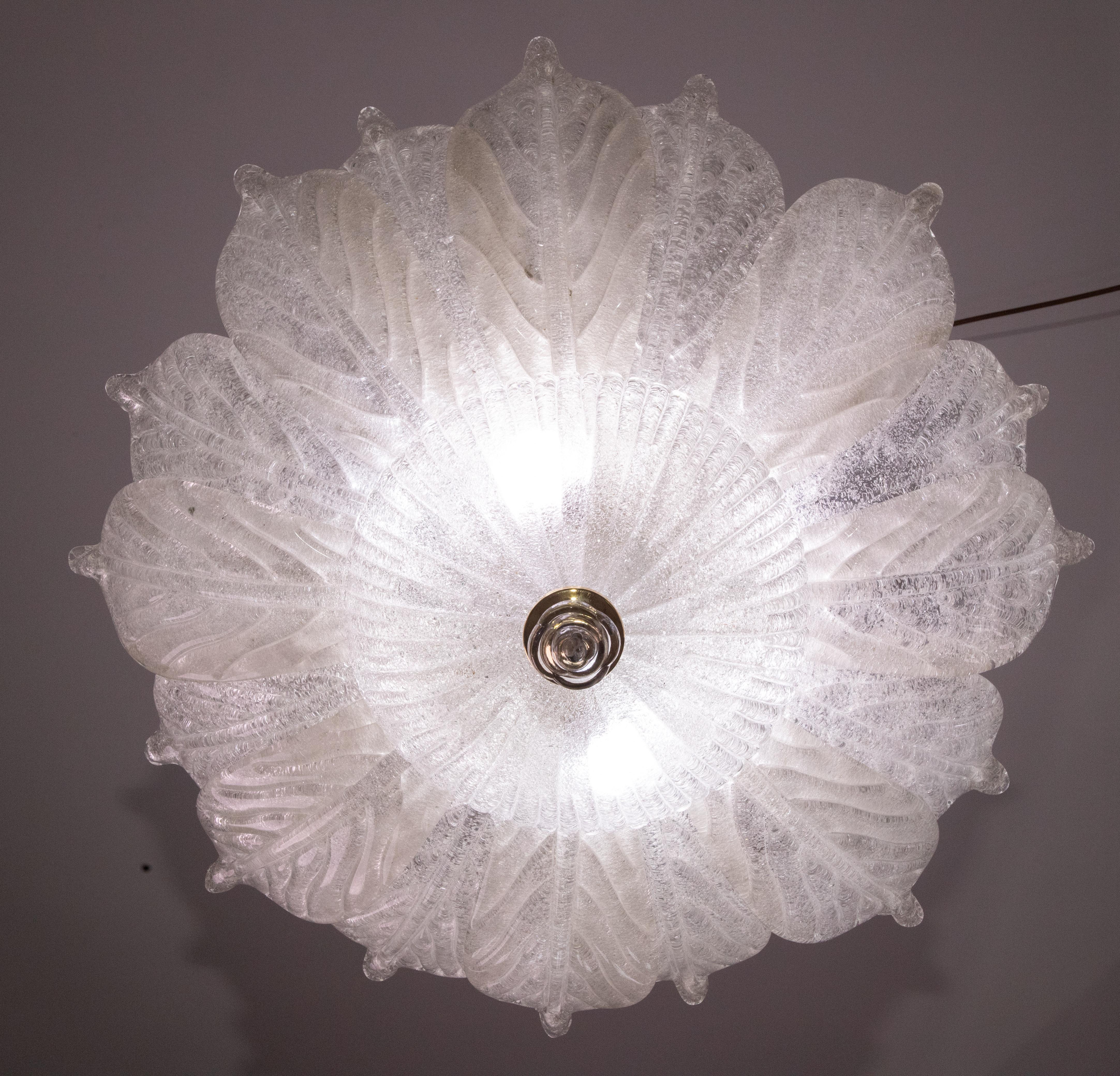 Splendid Murano glass ceiling lamp.

Period: circa 1970.

The light mounts 10 standard European e14 lamp holders.

Perfect for decorating a large space.

Height measures 30 centimeters from the ceiling, diameter about 70-75 centimeters.