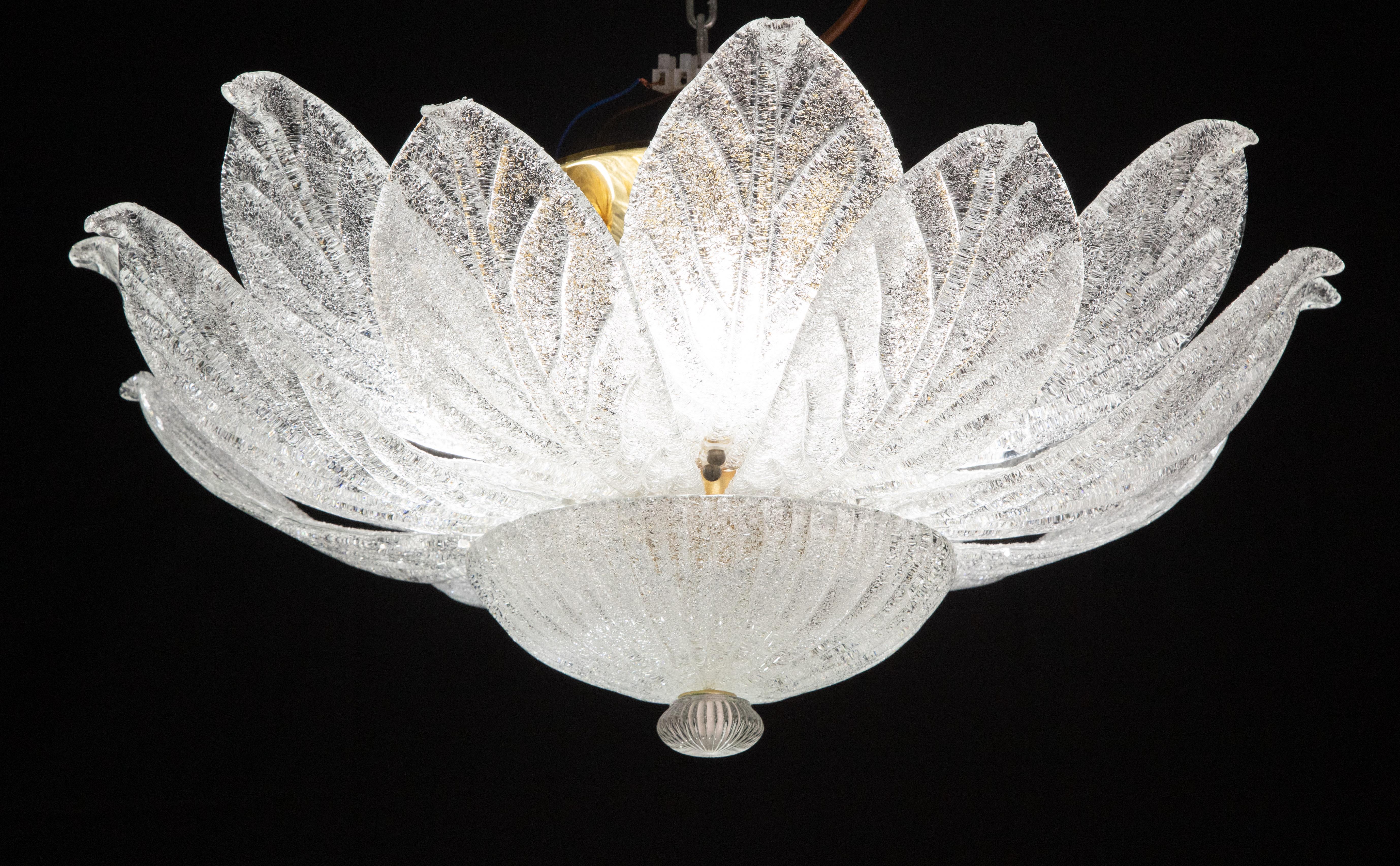 Splendid Murano glass ceiling lamp.

Period: circa 1970.

The light mounts 4 standard European e27 lamp holders.

Perfect for decorating a large space.

Height measures 30 centimeters from the ceiling, diameter about 80 centimeters.

Avaible also a