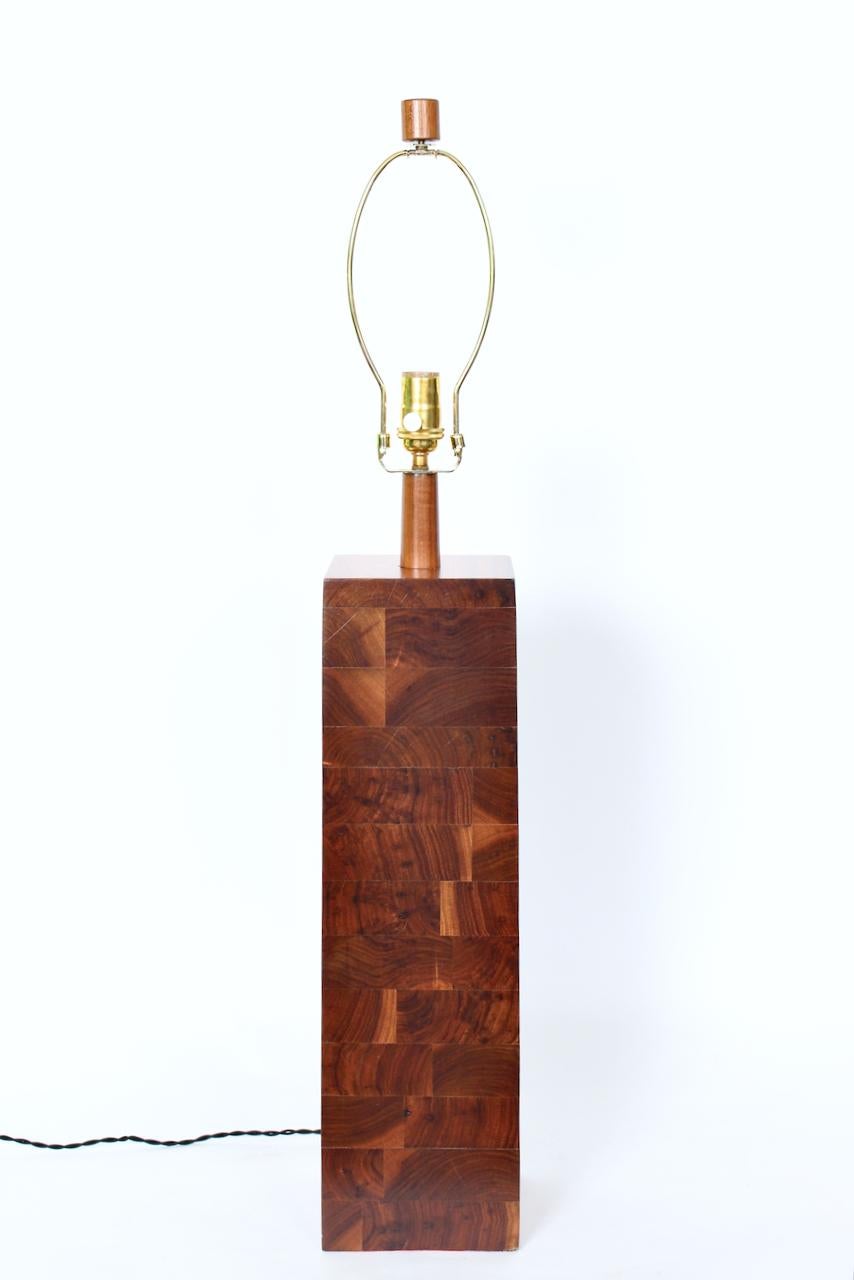 Tall American Mid Century Martz Marshall Studios SW31 stacked Walnut Lamp. Featuring a rectangular, architectural, solid form with exceptional natural grain detail. Walnut narrows slightly towards top. Walnut neck. Original Walnut finial. Small