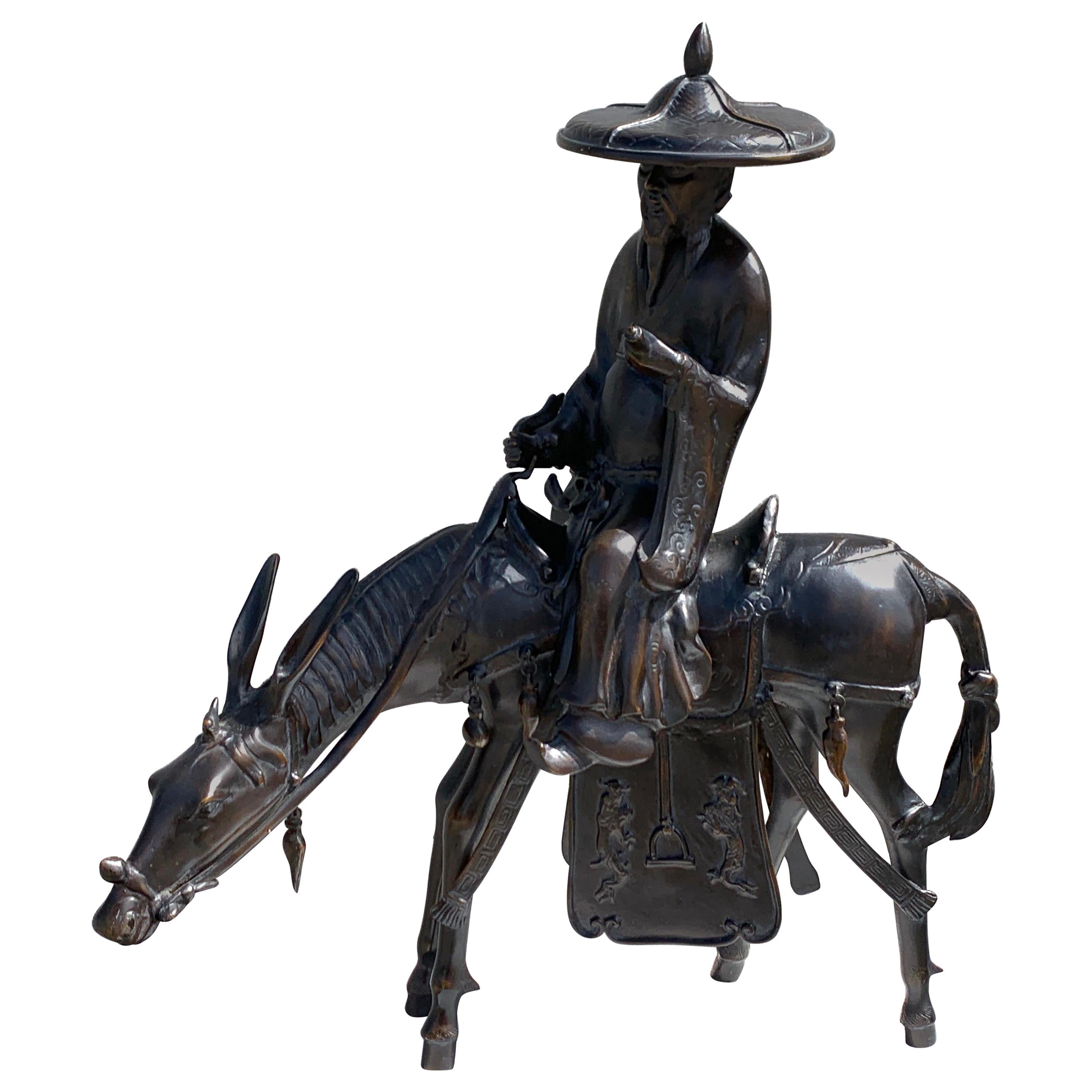 Monumental Japanese Iron Figure of Toba Seated on His Mule, Shōwa Period