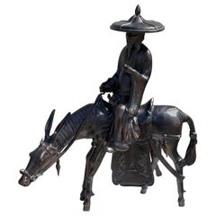 Monumental Japanese Iron Figure of Toba Seated on His Mule, Shōwa Period