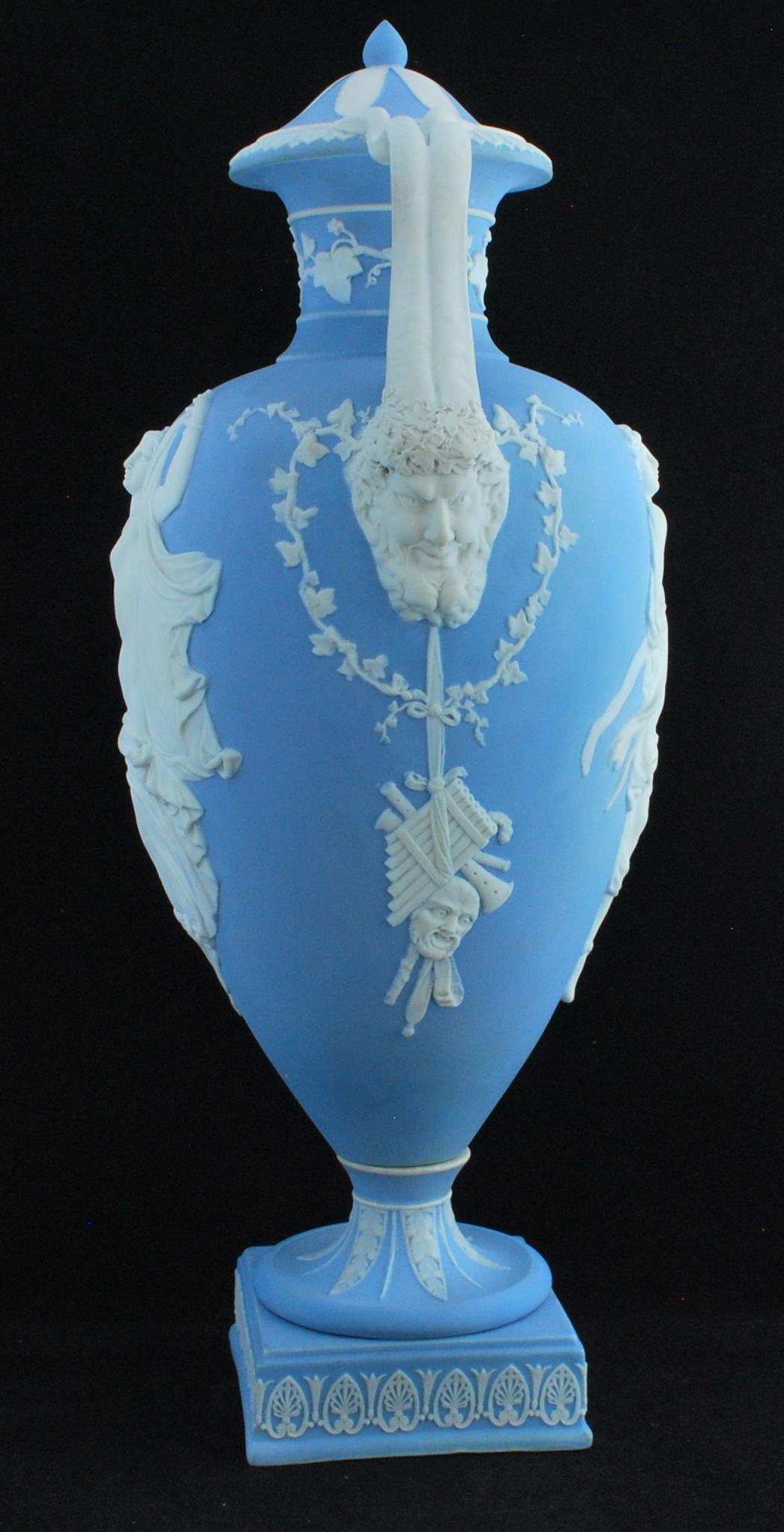 A monumentally tall vase in solid pale blue jasper, decorated with nymphs after Herculaneum wall paintings.


  