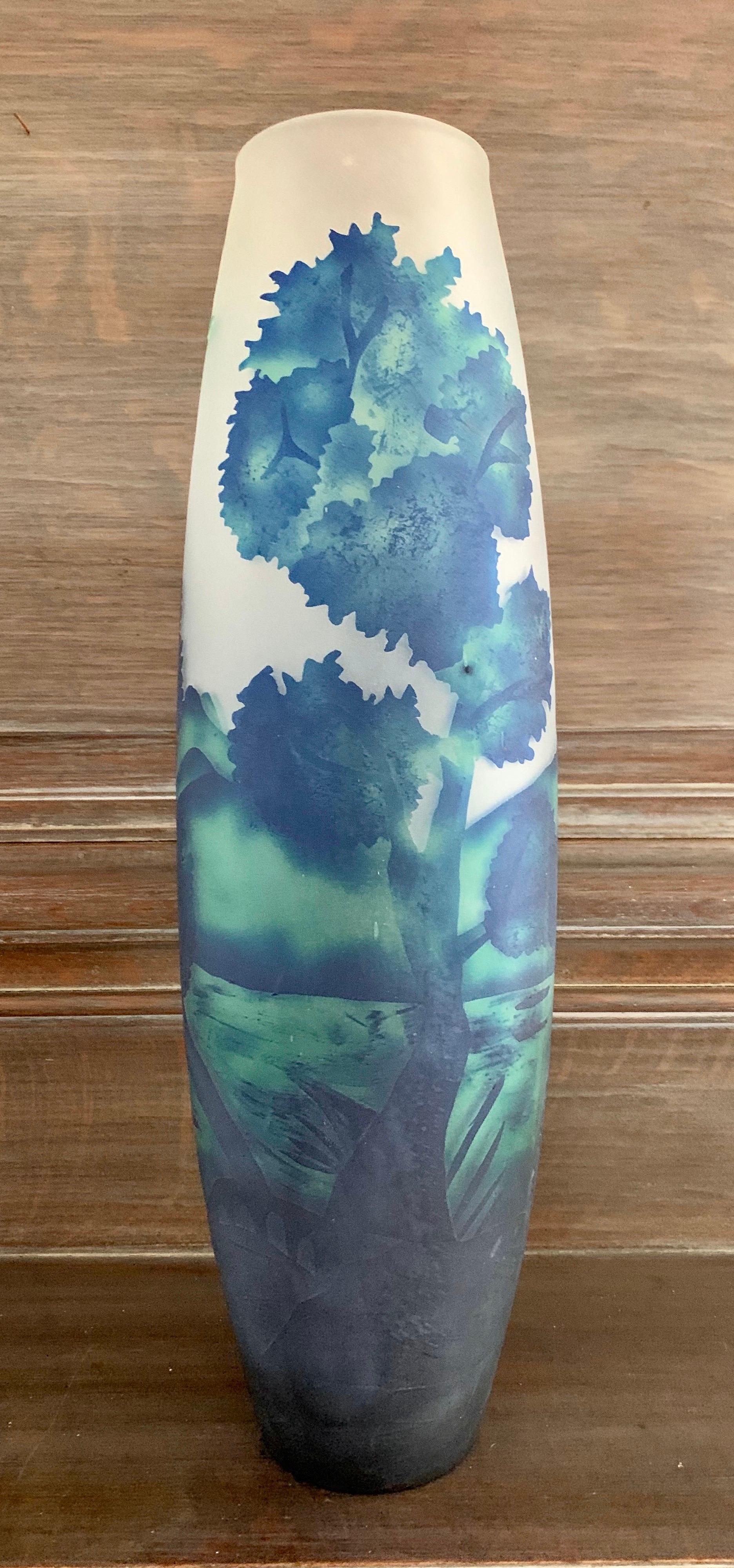 Unusual Art Nouveau etched glass vase that measures twenty inches tall by seven inches wide.
The color scheme is spectacular, with blues and greens on etched glass, again very unusual.
No signatures, circa 1970s. Great condition with no flaws.