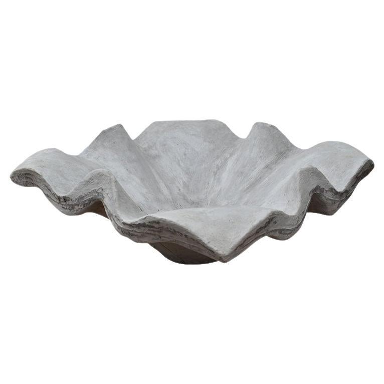 An organic modern monumental sculptural concrete or cement handkerchief planter. Fabulous for either indoor or outdoor use, this vessel is very heavy and thick. The base is flat and solid with no holes. When filled with water, the water holds,