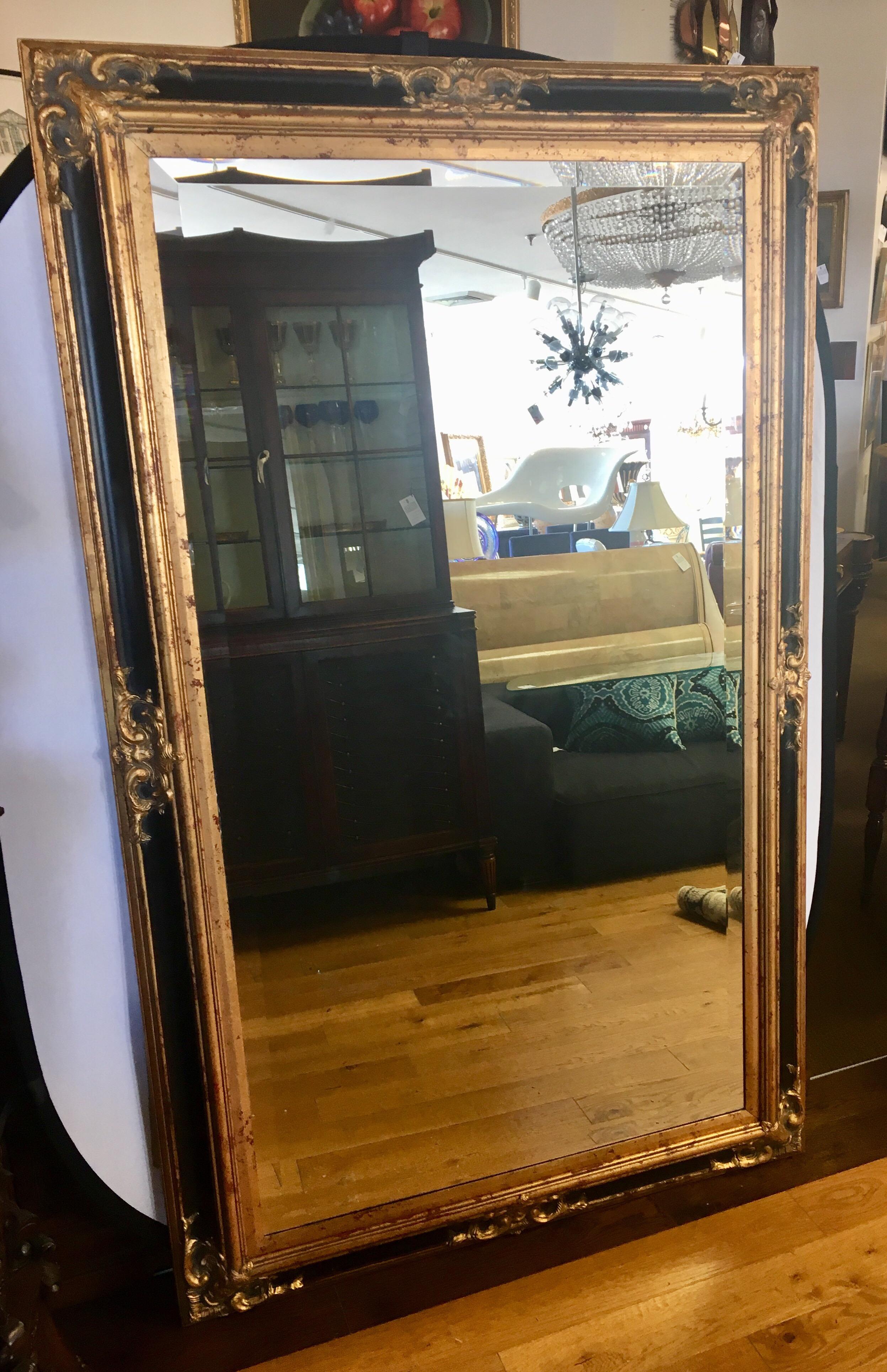 Stunning neoclassical composite full length floor mirror, beveled with black and gold composite border.
Ready to hang horizontally also. The color scheme and detail are extremely elegant and would highlight
many types of decor.