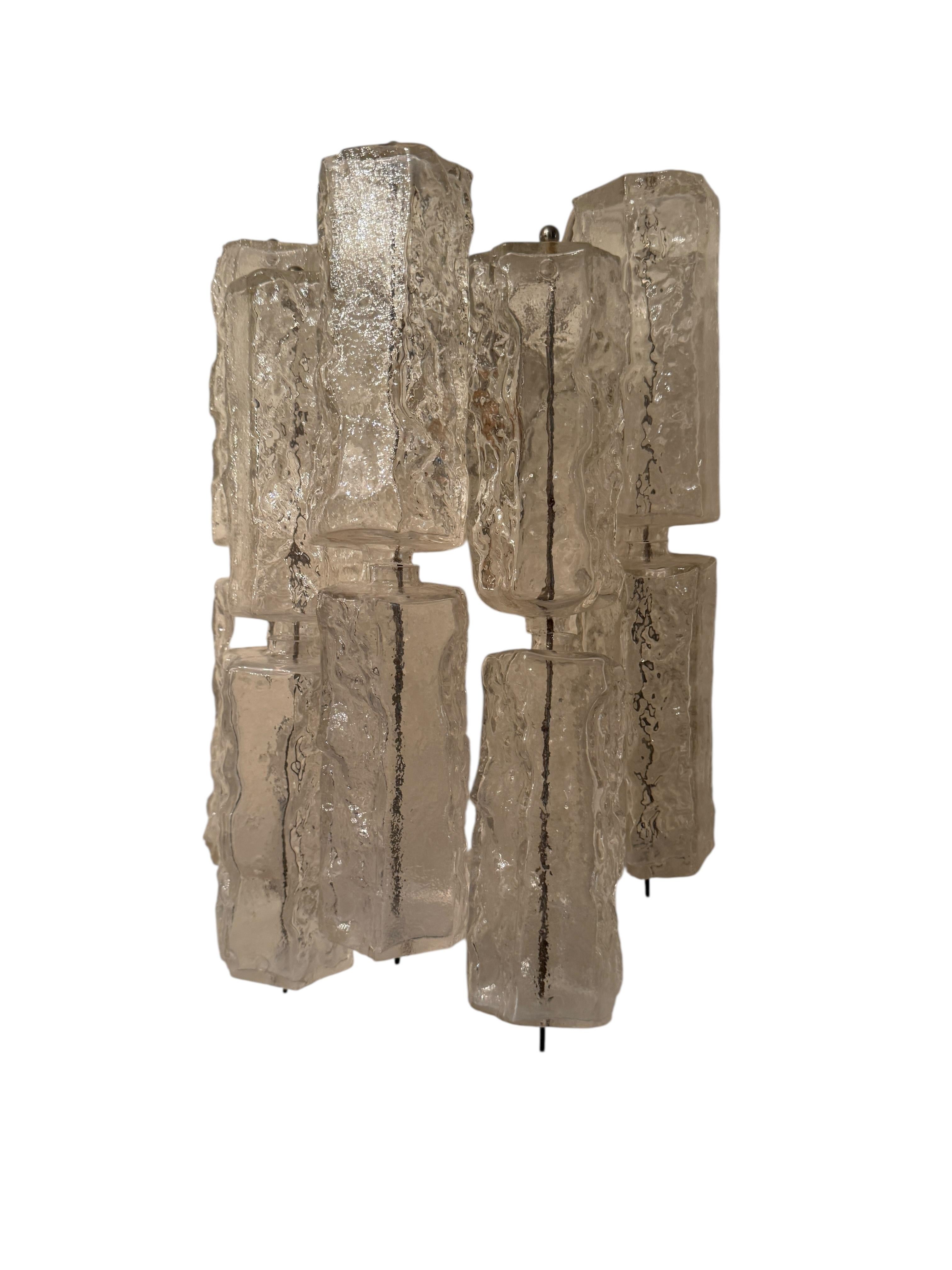 This exquisite large sconce or wall light was made by the legendary atelier of Venini in Italy, circa 1960s. It features hand blown thick and heavy Murano glass tubes on a white metal frame. With its clean modernist lines and timeless sensibility,