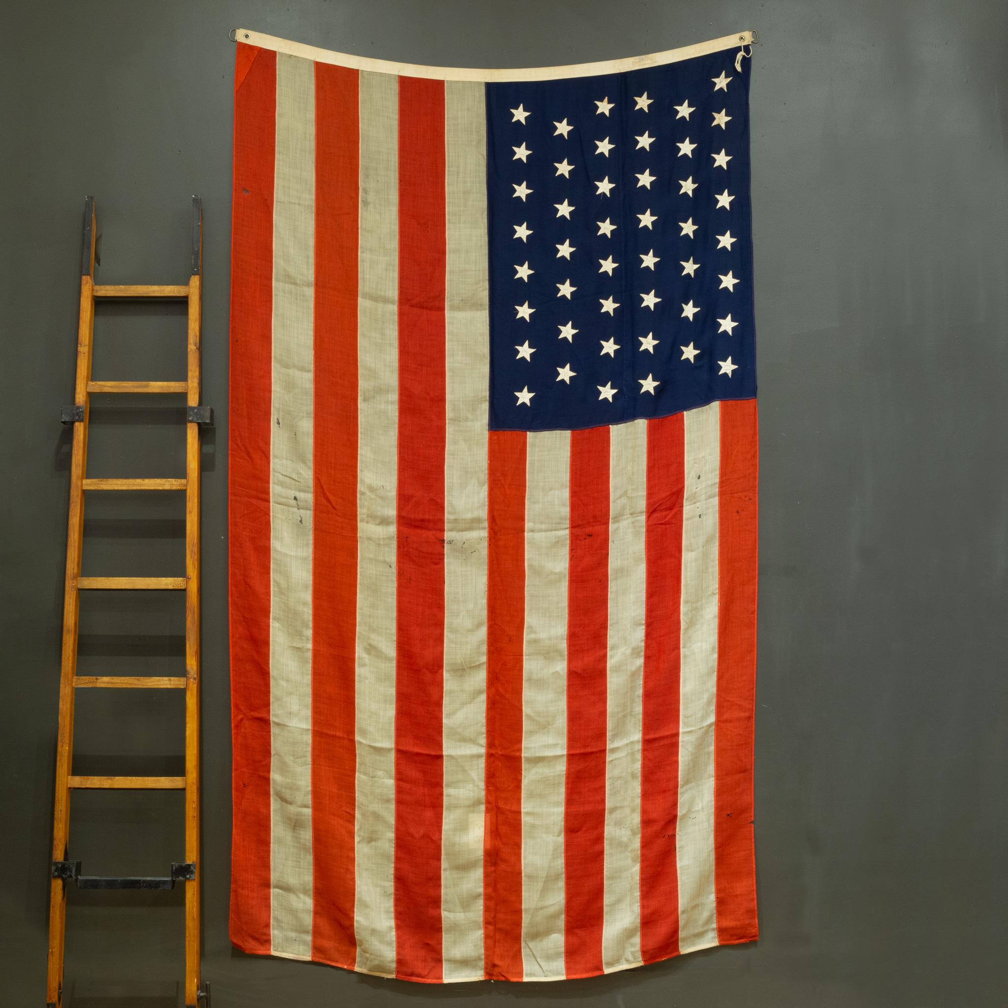 ABOUT

A monumental linen American flag with 48 stars, metal grommets and metal rings.

    CREATOR Double Wrap.
    DATE OF MANUFACTURE c.1940-1950.
    MATERIALS AND TECHNIQUES Linen, Metal.
    CONDITION Good. Wear consistent with age and use.