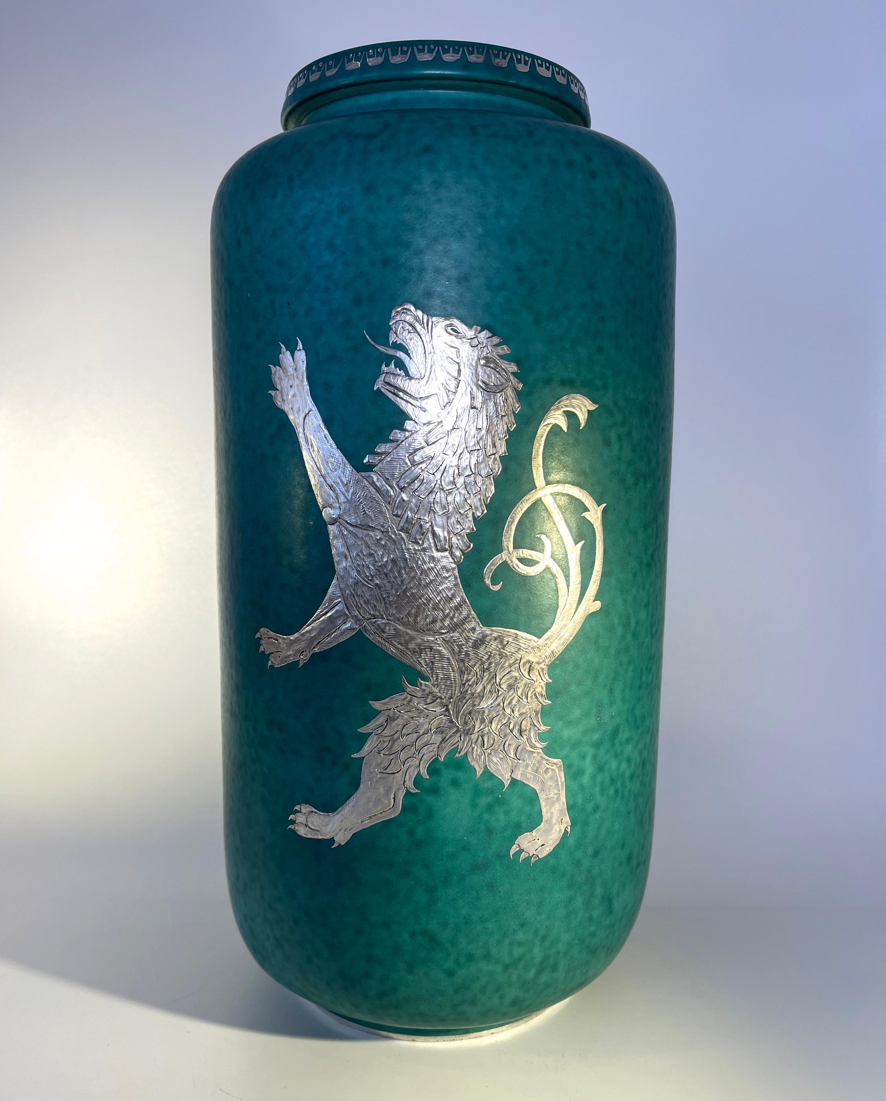 Magnificent Lion Rampant gigantic urn vase by Wilhelm Kage for Gustavsberg, Sweden
An imposing and grand piece from the Argenta series
Green mottled stoneware vase decorated with applied silver
Without question, a connosieur piece 
Circa 1941 Date
