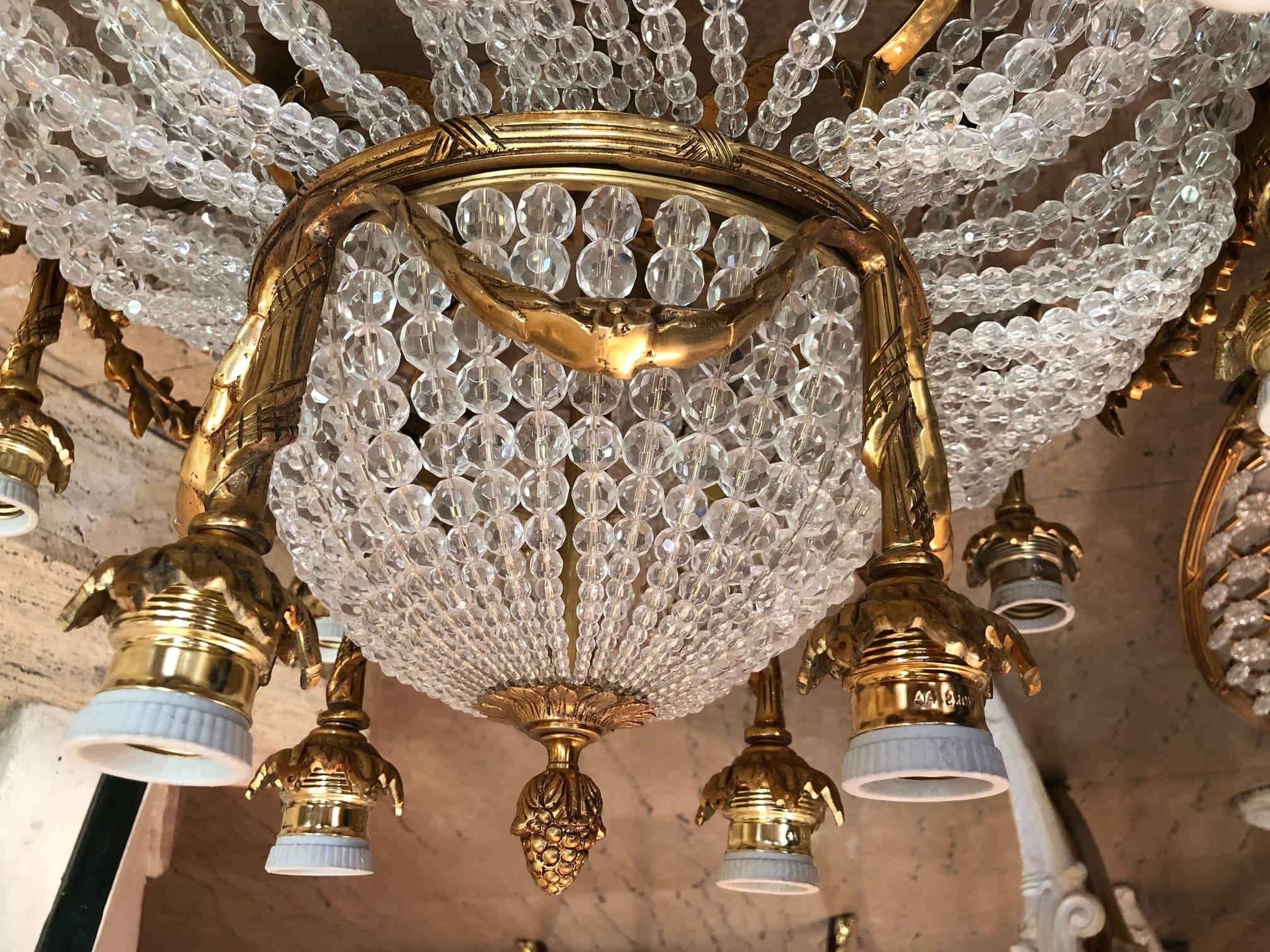 Unique oval ceiling lamp or plafonière in Louis Seize style. Exceptionally fine, engraved and cast bronze. Round basket-formed corpus from handcut Frenches ball prisms (over 3,000 pieces). Connected through wide, ornamental relieved and broken