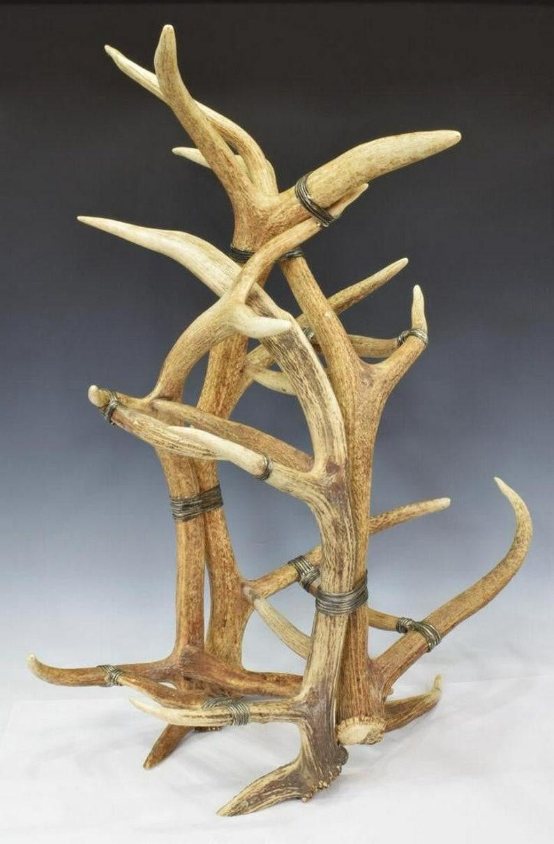 A spectacular statement piece, this large tabletop wine bottle rack fashioned from antlers, held together with heavy gauge silver-tone wire wrapping. Handcrafted in the late 20th century, highest of quality, attributed to amazing American luxury