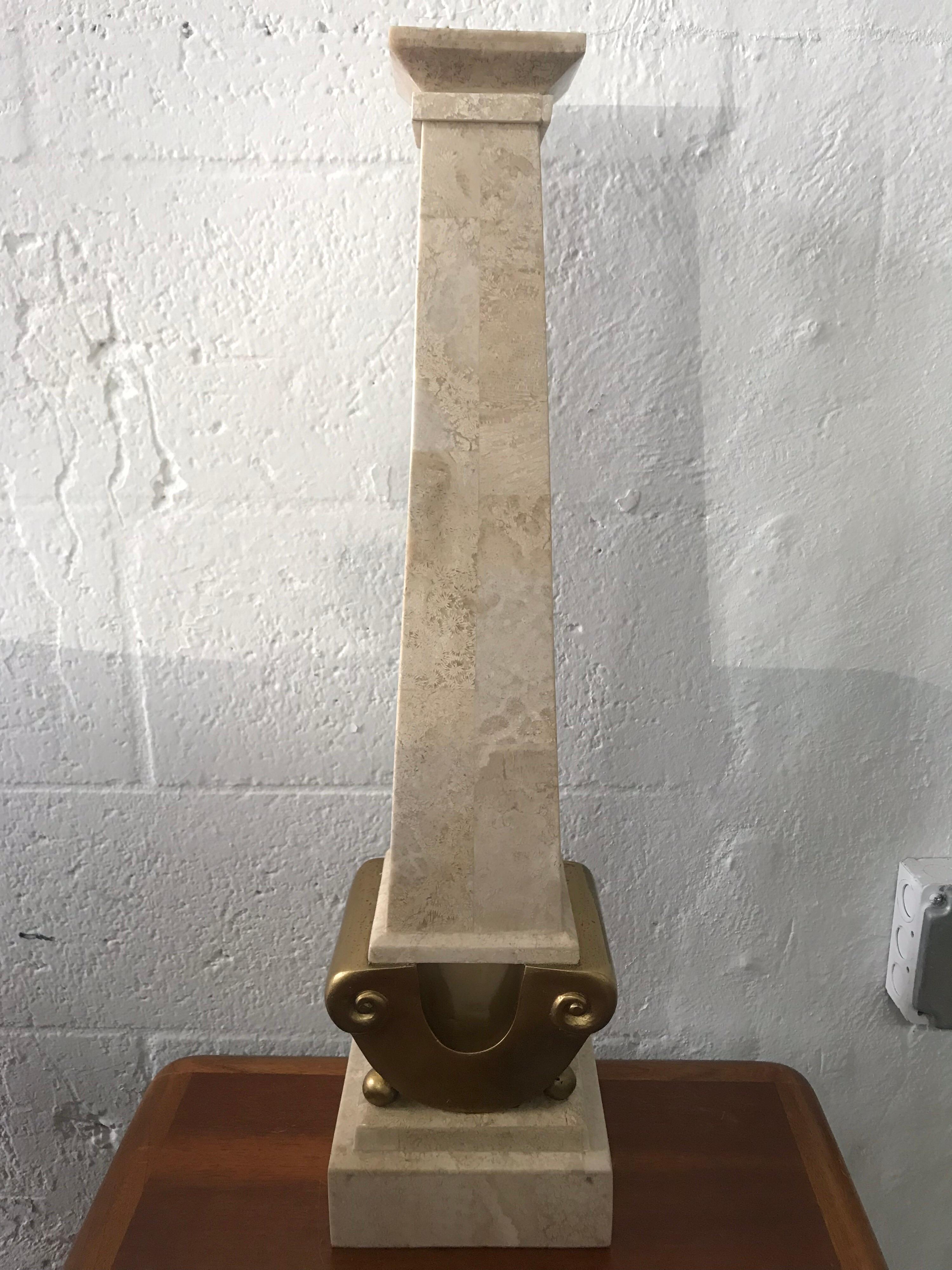 Large scale candlestick in neoclassical form rendered in tessellated marble stone and gilt by Maitland smith. 1970s