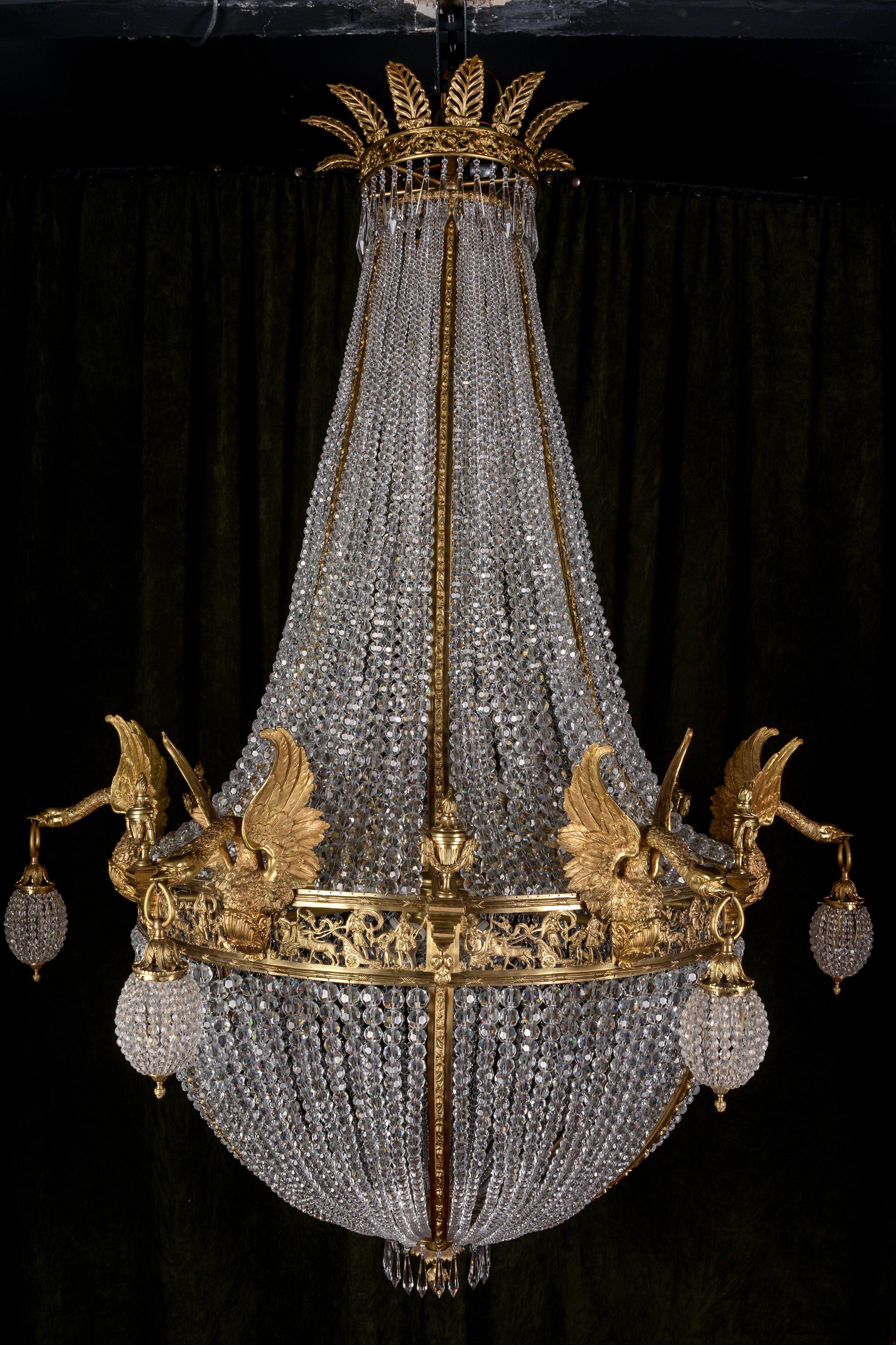 Monumental Majestic splendid chandelier in Empire Style referred to Empress Joséphine.
Exceptionally fine, engraved and cast Bronze. Basket-formed corpus from hand-cut frenches ball prisms (over 11,000 pieces). Connected through wide, mythological