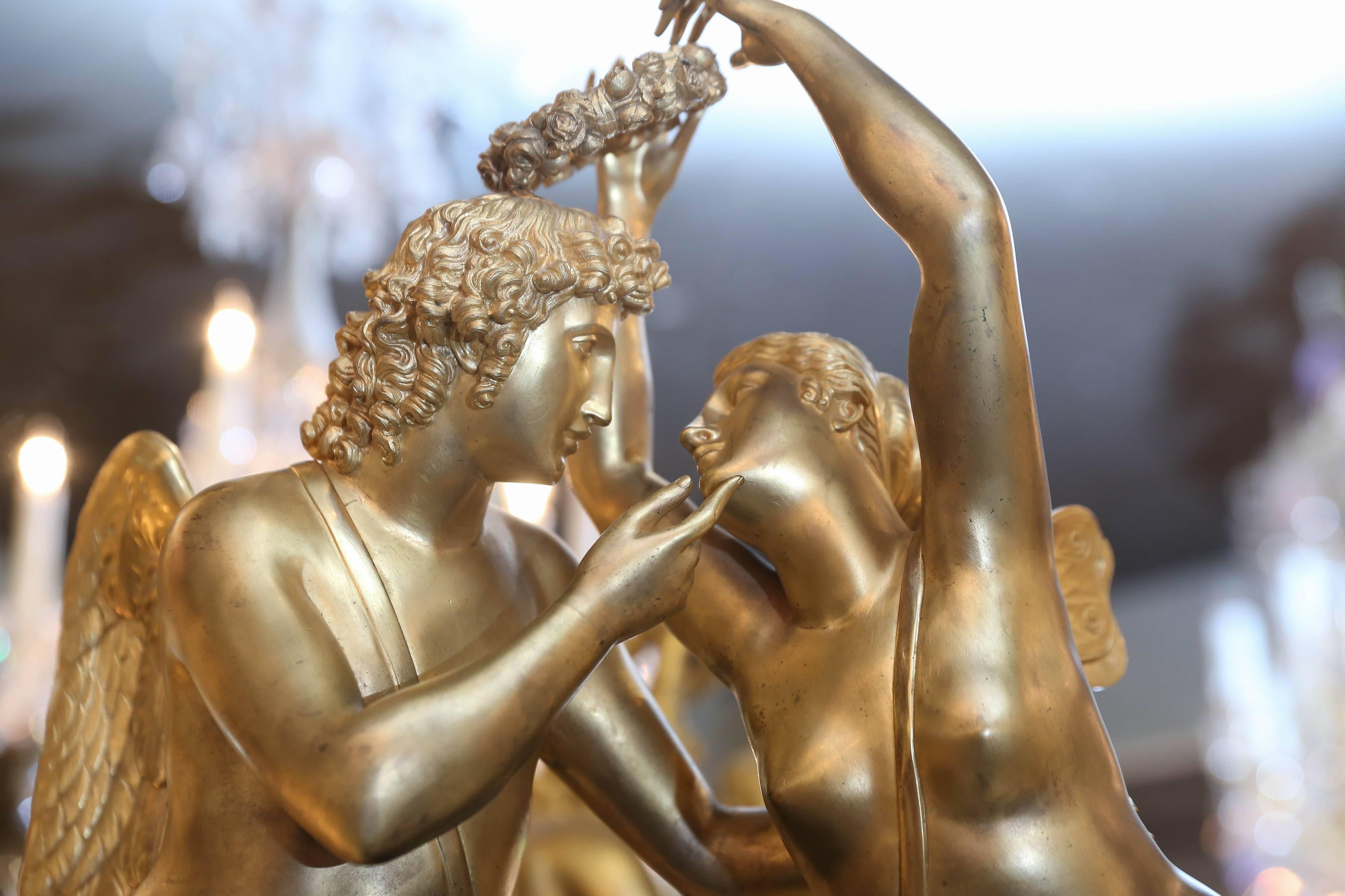 Empire Monumental Marble and Bronze Dore’ Clock Adorned with Psyche and Amor Figures