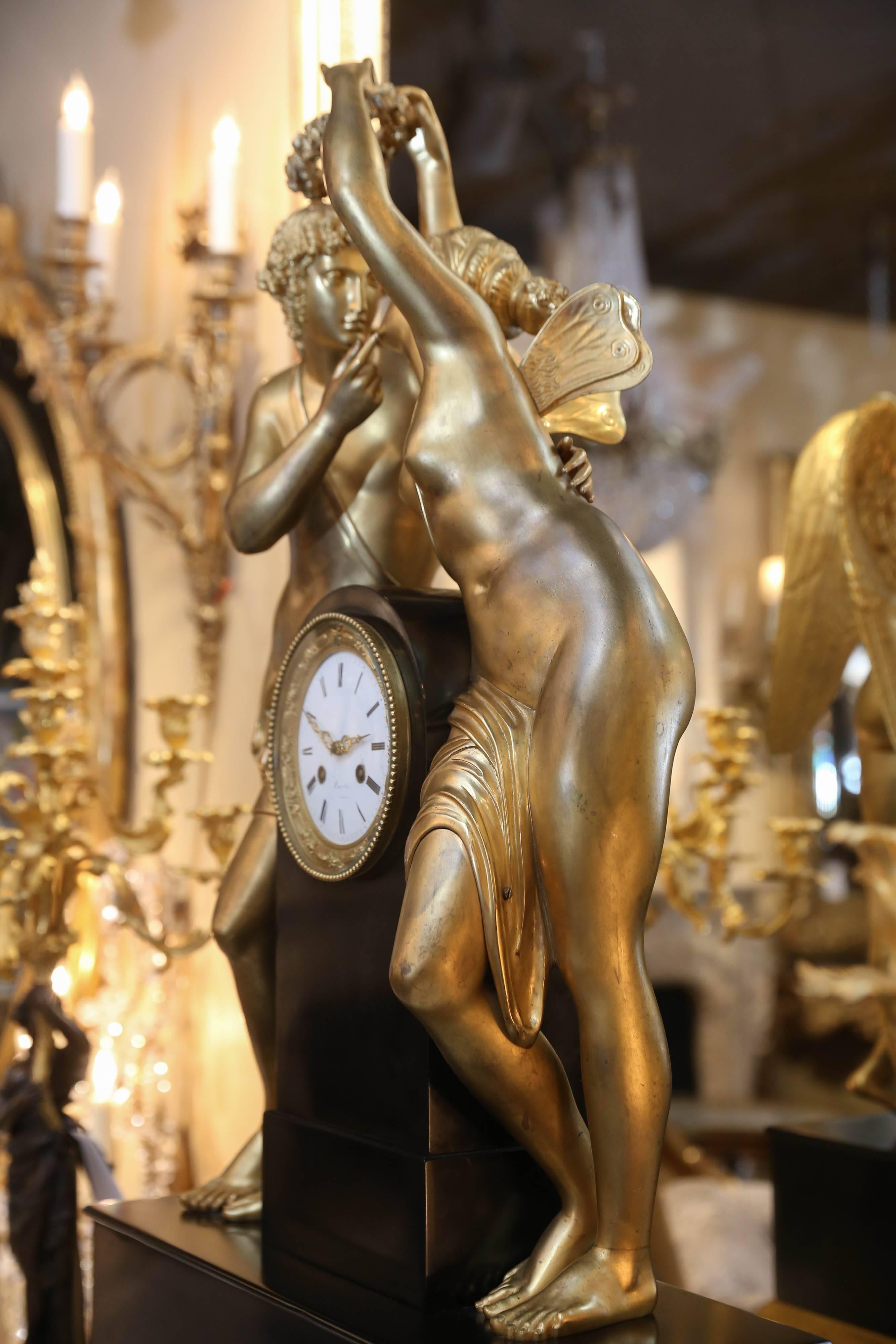 French Monumental Marble and Bronze Dore’ Clock Adorned with Psyche and Amor Figures