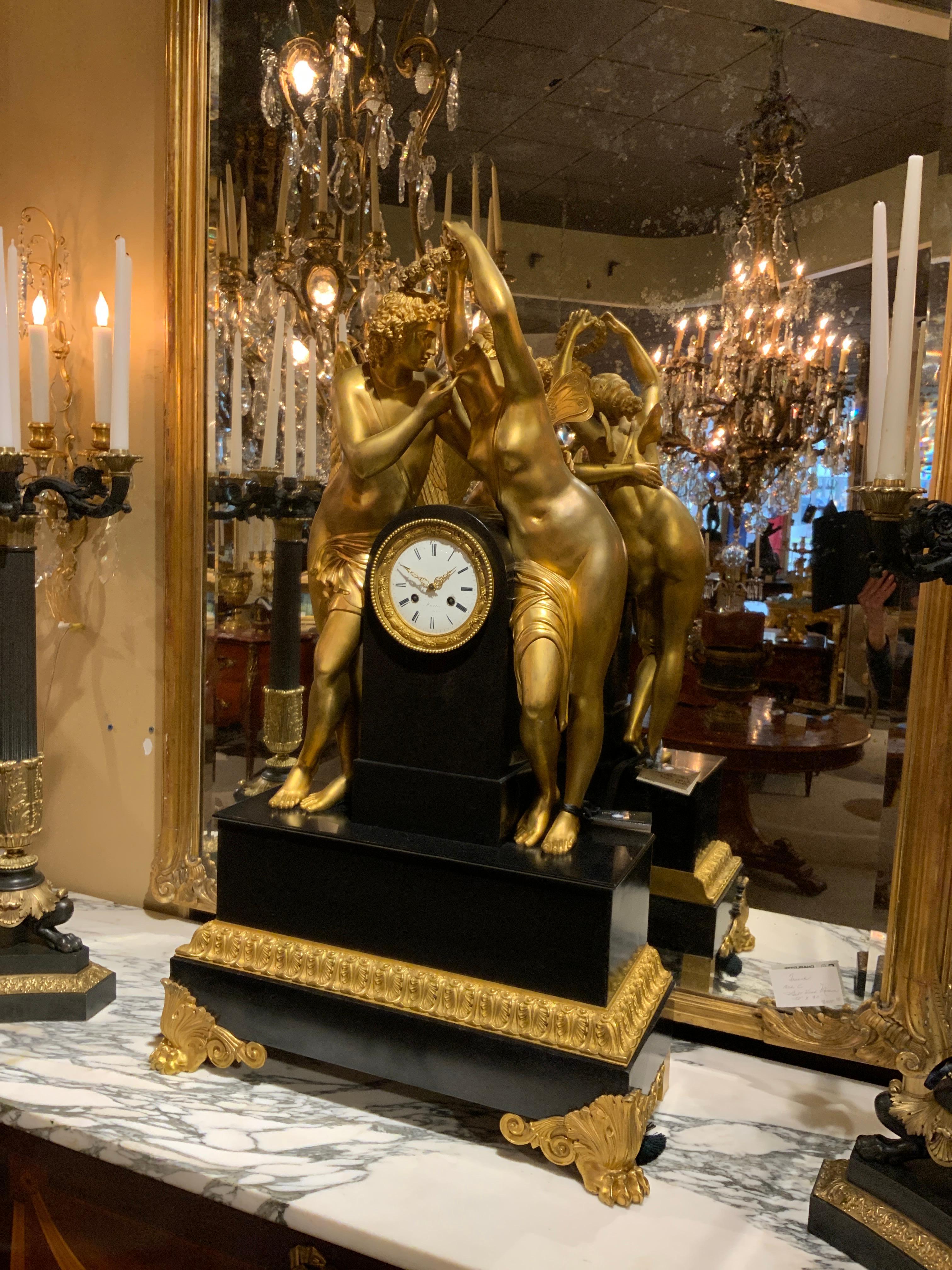 Palace size  Marble and Bronze Dore’ Clock Adorned with Psyche and Amor Figures In Excellent Condition For Sale In Houston, TX