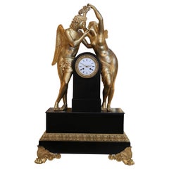 Monumental Marble and Bronze Dore’ Clock Adorned with Psyche and Amor Figures