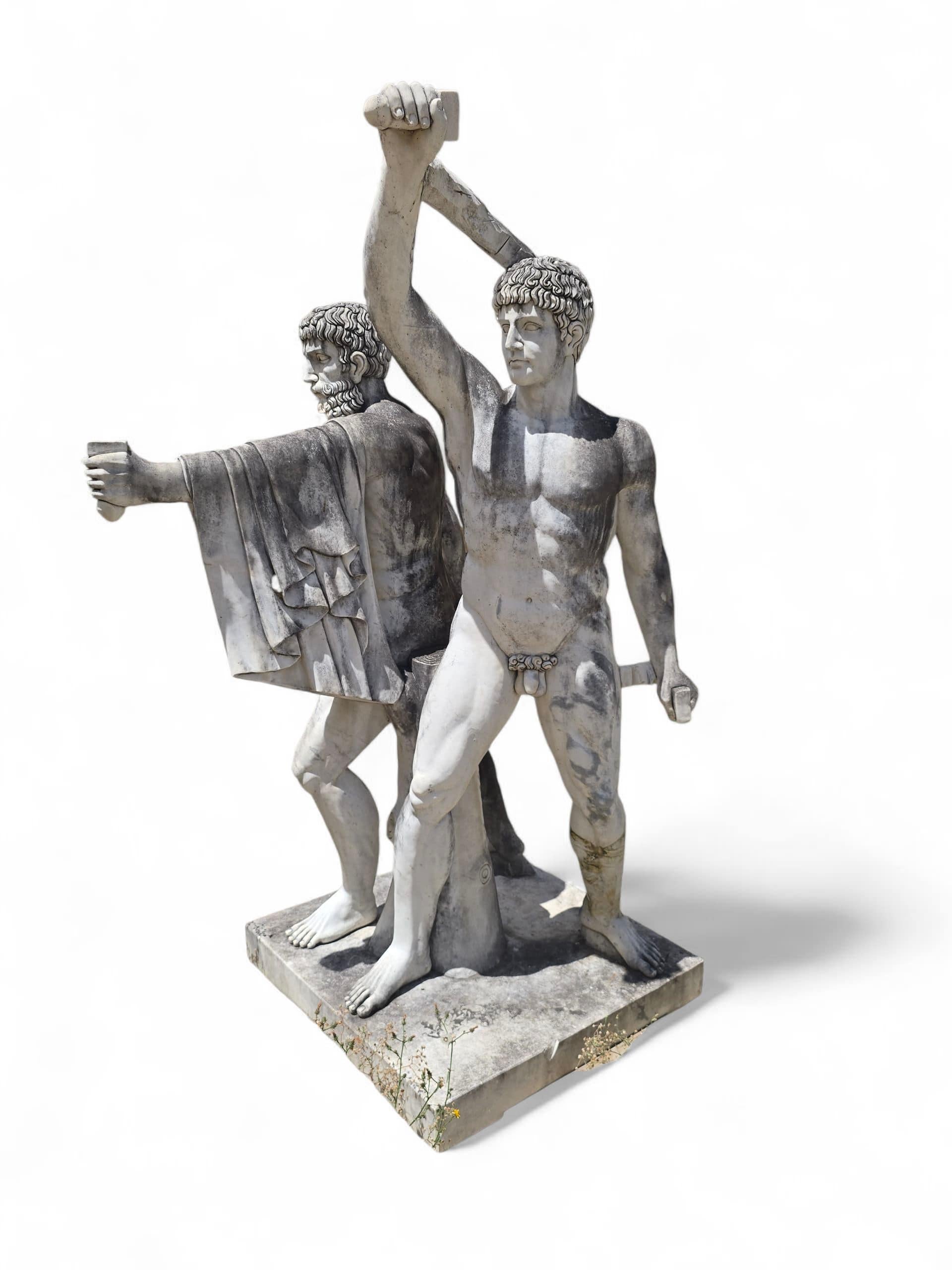 Striking and monumental marble sculpture representing the iconic pair of Greek warriors known as The Tyrannicides—Harmodius and Aristogeiton. Carved in Italy in the early 20th century, this powerful composition captures the dynamic tension and