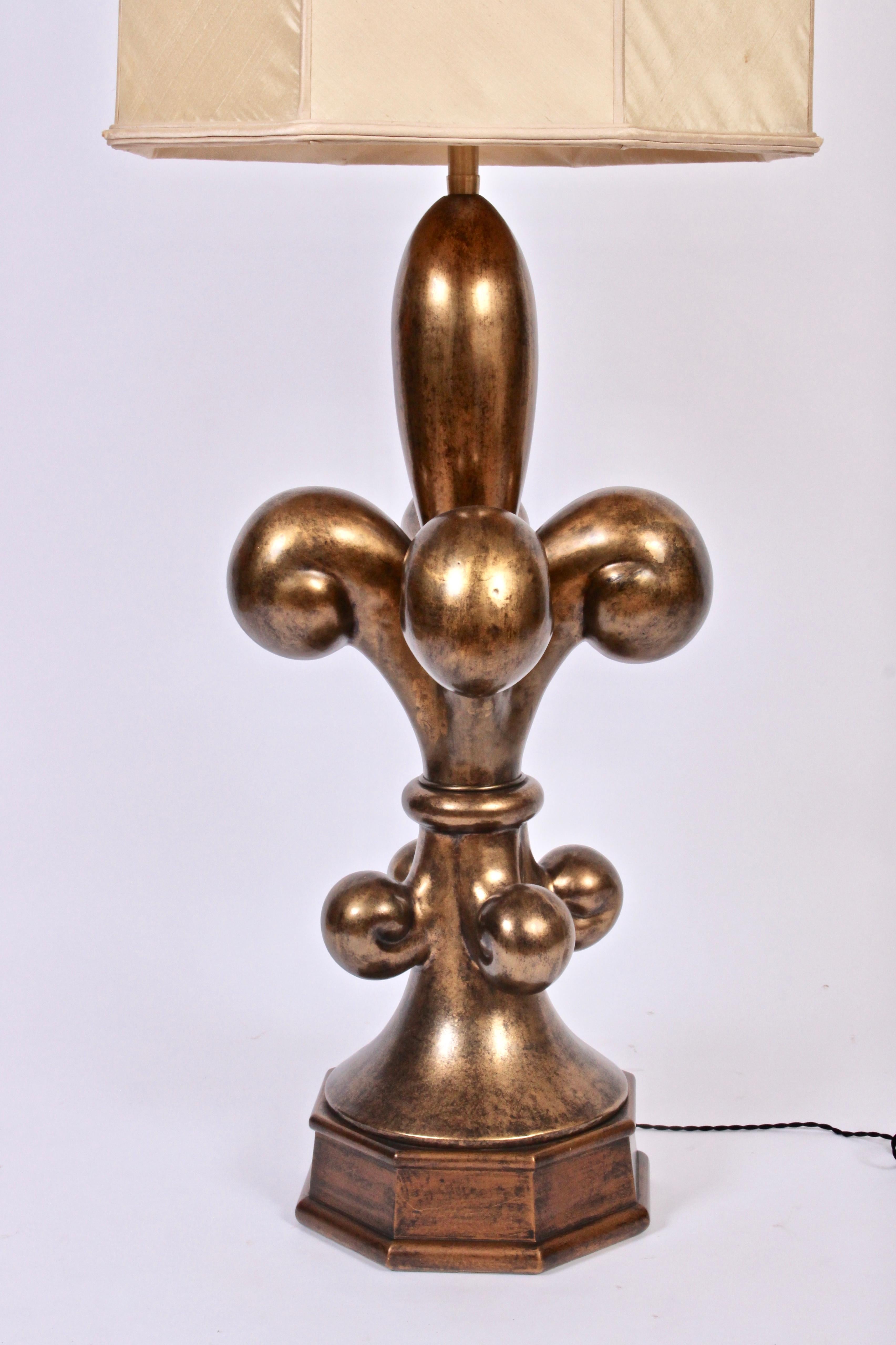 Substantial Six Foot Marbro Lighting Company Brass Table Lamp with White Milk Glass Shade. Statuesque sculptural fleur de lis form with Antique Brass finish. Stands approximately 6 feet tall. Includes glass liner shade. 52.5H to top of socket.