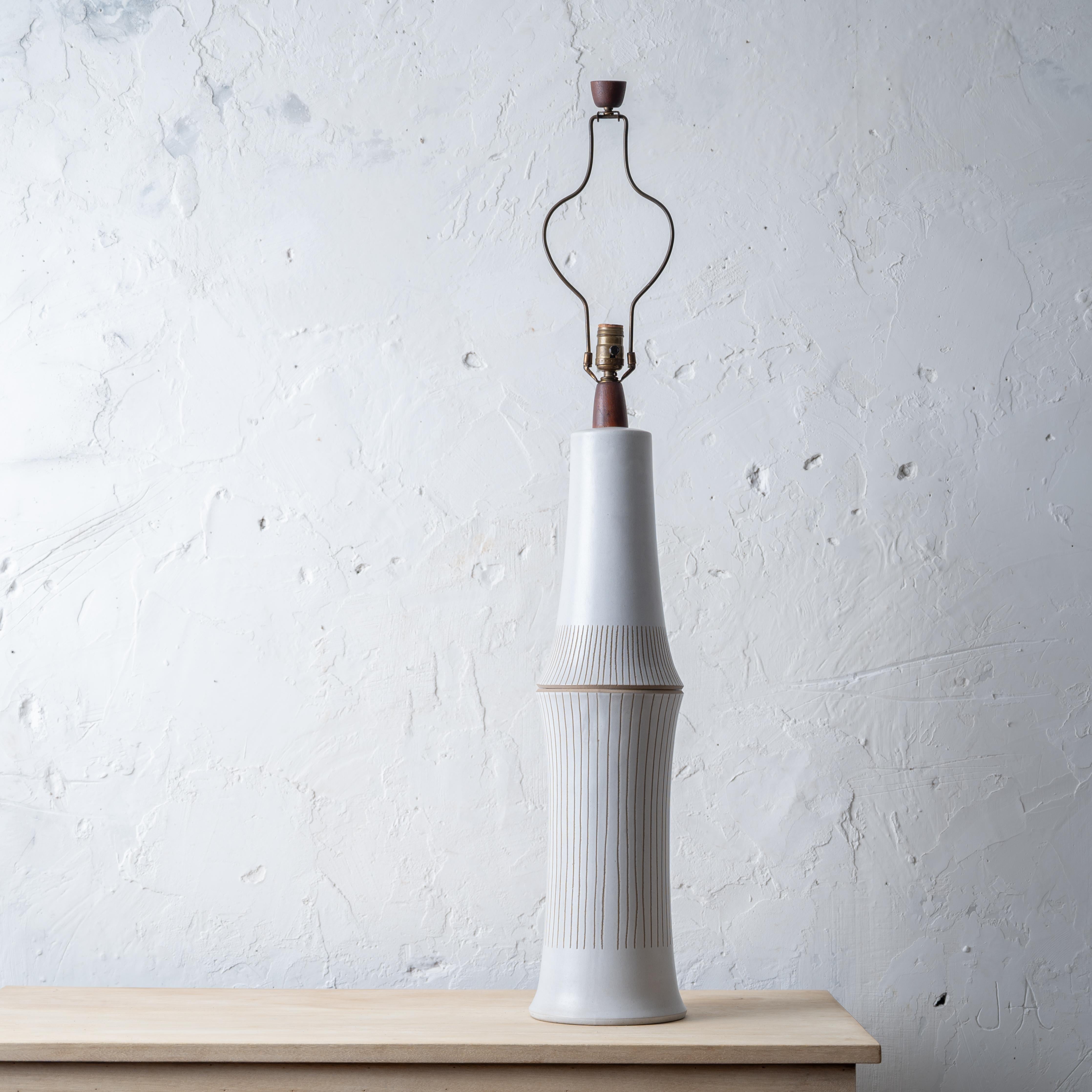 A monumental Martz Studio ceramic lamp, 1950s.



7 ½ inches wide by 44 ½ inches tall;

28 inches top of ceramic



