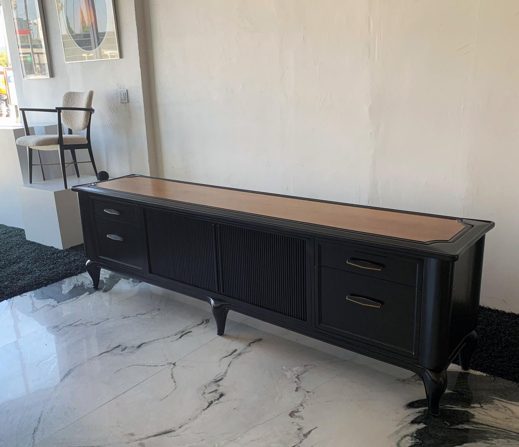 Available right now we have this beautifully refinished monumentally sized credenza or sideboard designed by Maurice Bailey for Monteverdi-Young. Finished and ebonized on all sides, this is a perfect piece to be used in the middle of a room as a