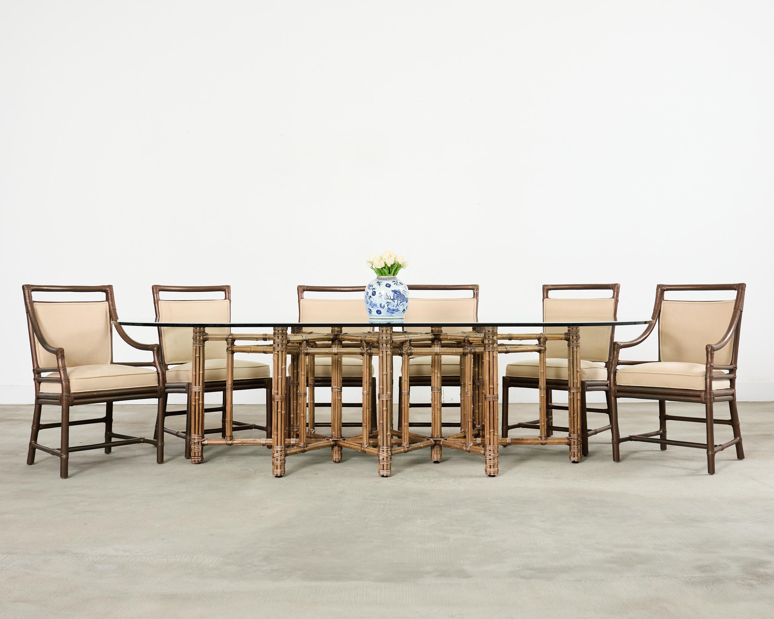 Amazing one-off monumental oval dining table crafted in the California coastal organic modern style by McGuire artisans. The bespoke table was custom ordered with an octagonal shaped star base to accommodate 8 to 10 diners. The table is constructed