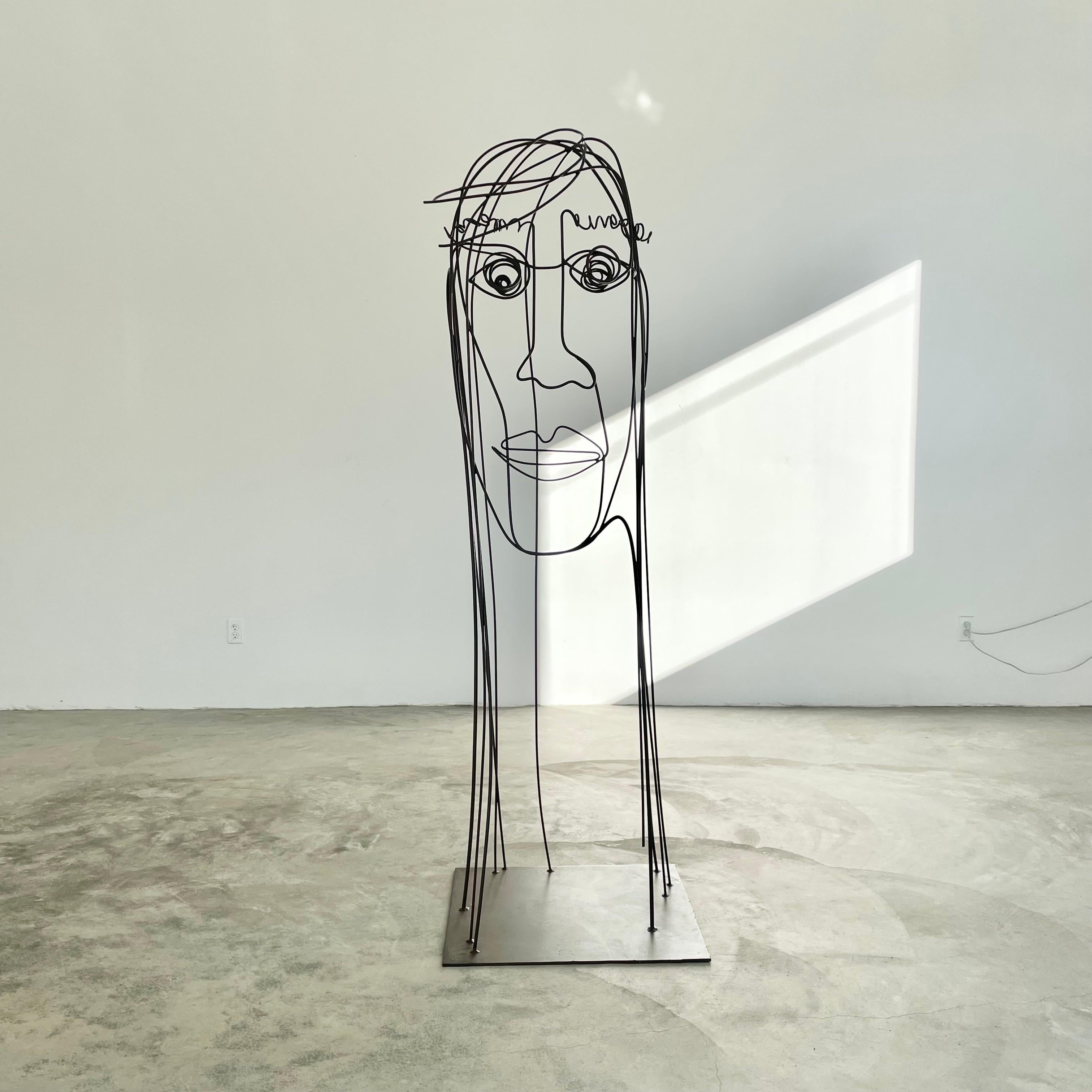 Stunning metal wire sculpture resembling a woman's face and hair. Huge impact and presence in person. Substantial metal wire is bent, molded and wrapped in order to give this piece its abstract structure and beautiful lines. Pieces are either powder
