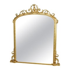 Monumental Mid-19th Century Carved Giltwood Rococo Mirror with Original Plate