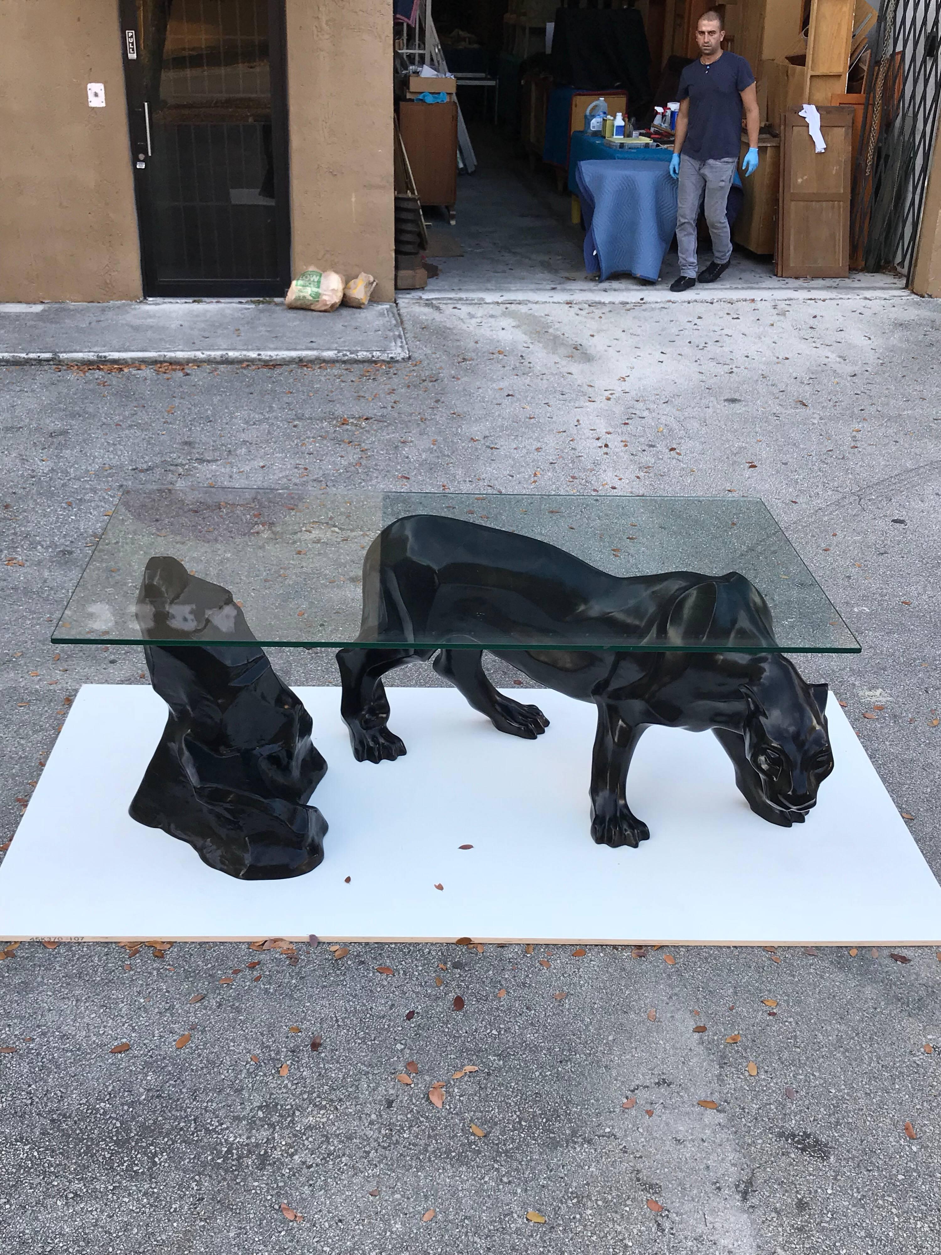 Monumental Mid-Century Modern black panther centre table or console table, with finely detailed panther and rock supports the glass top, It is black resin or fiberglass and has a high gloss finish, Beautiful centre table, with the original black