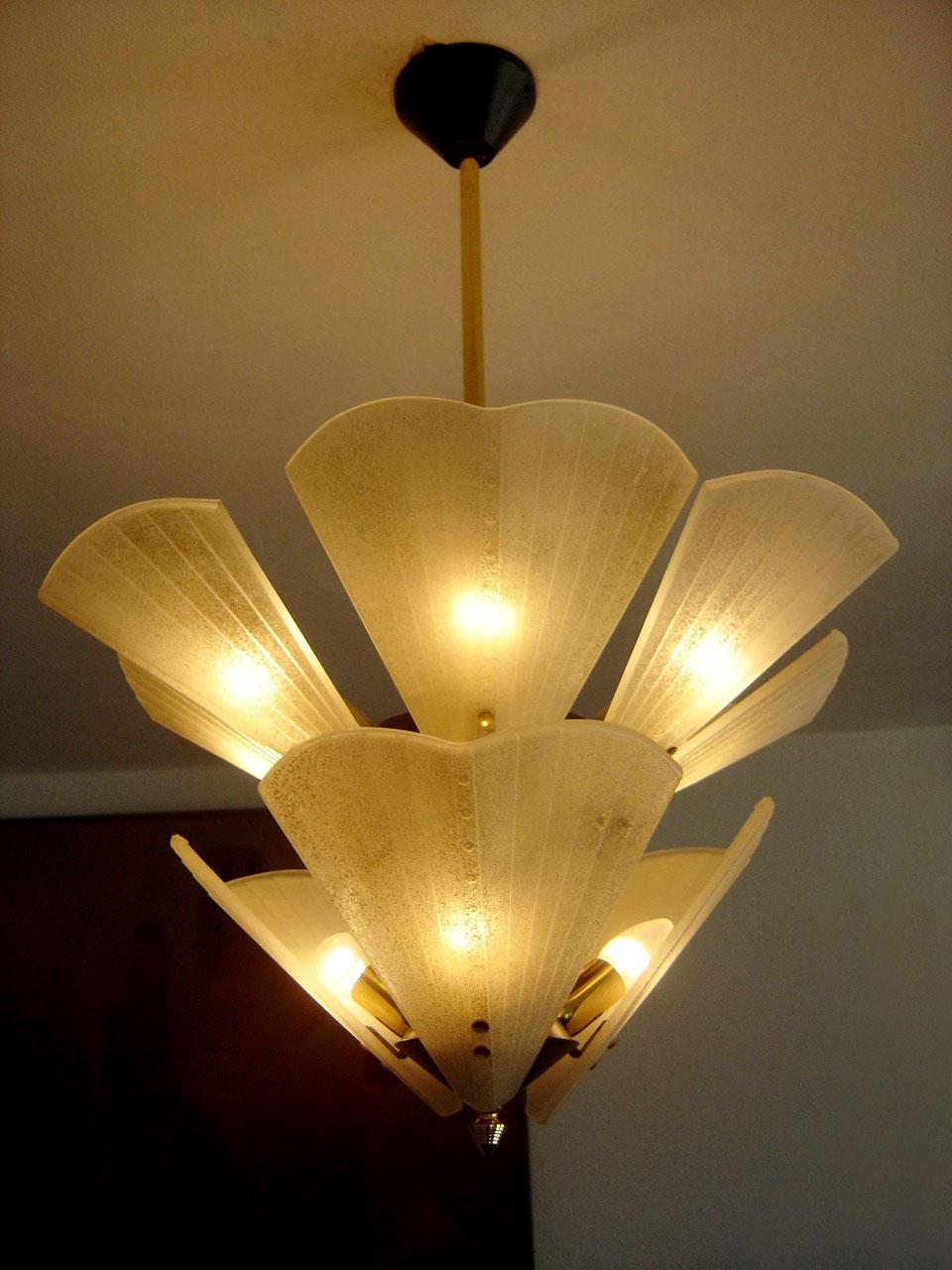 Exceptional & gorgeous Mid-Century Modern 9-flamed chandelier or pendant lamp. Designed and manufactured probably by J.T. Kalmar, Vienna, Austria, 1950s.

Executed with nine thick frosted glass elements and brass body. The chandelier needs 9 x E14