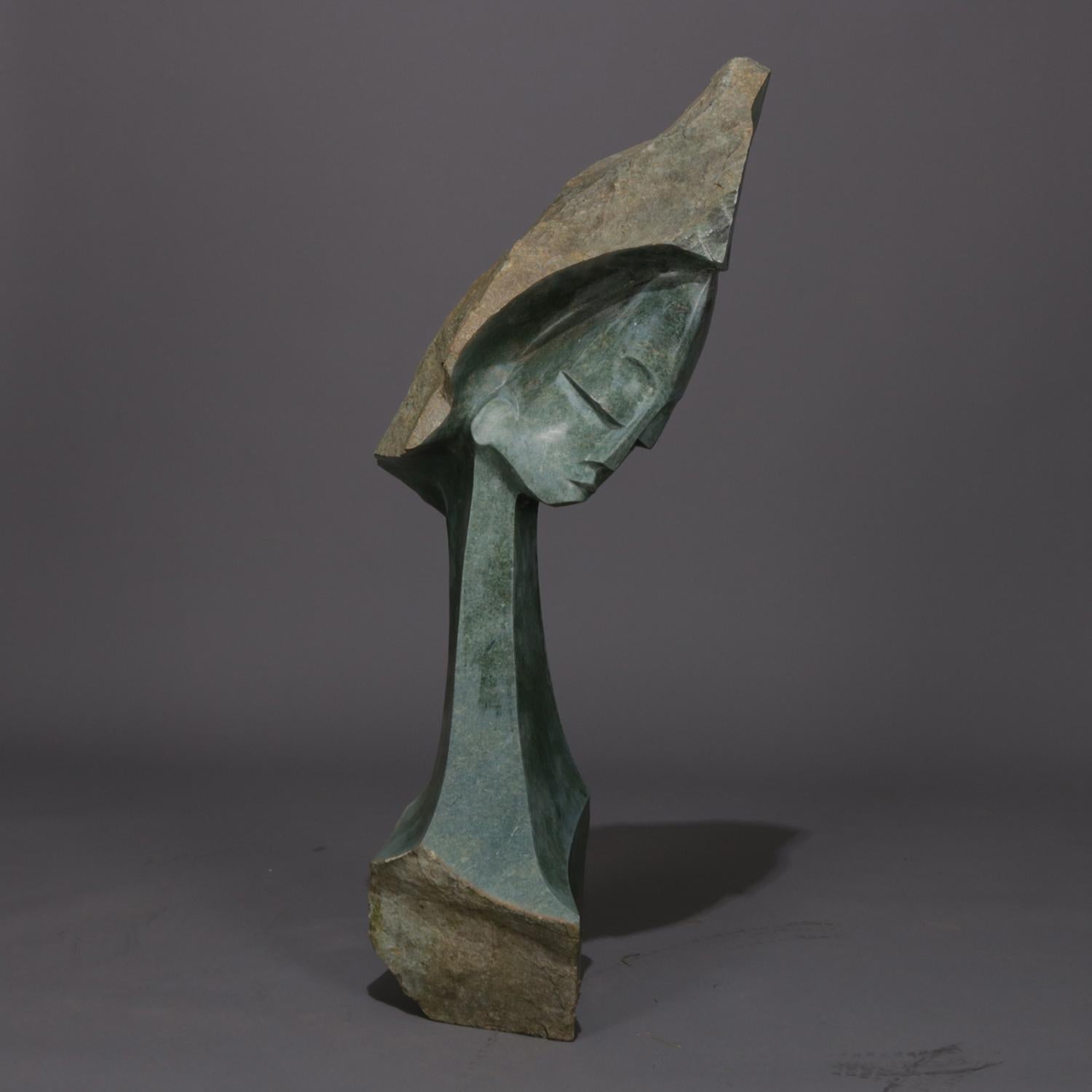Monumental Mid-Century Modern abstract hand carved serpentine portrait sculpture depicts bust of woman, 20th century.

Measures: 53