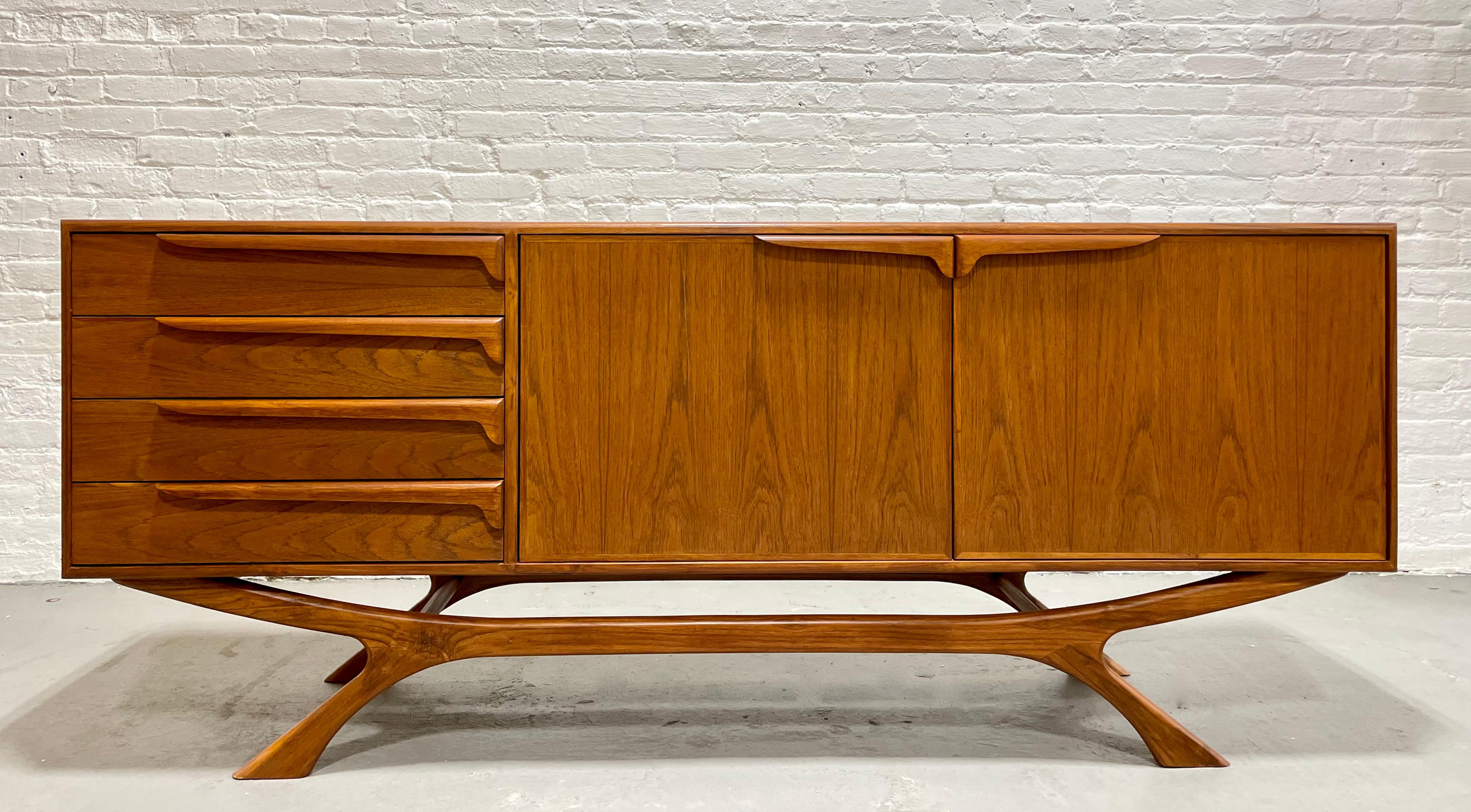Monumental Mid Century Modern styled Credenza / Media Stand with jaw-dropping base.  Perfect layout for a media stand - generous shelving (adjustable to three heights and removable) for components and four spacious drawers for remotes and other