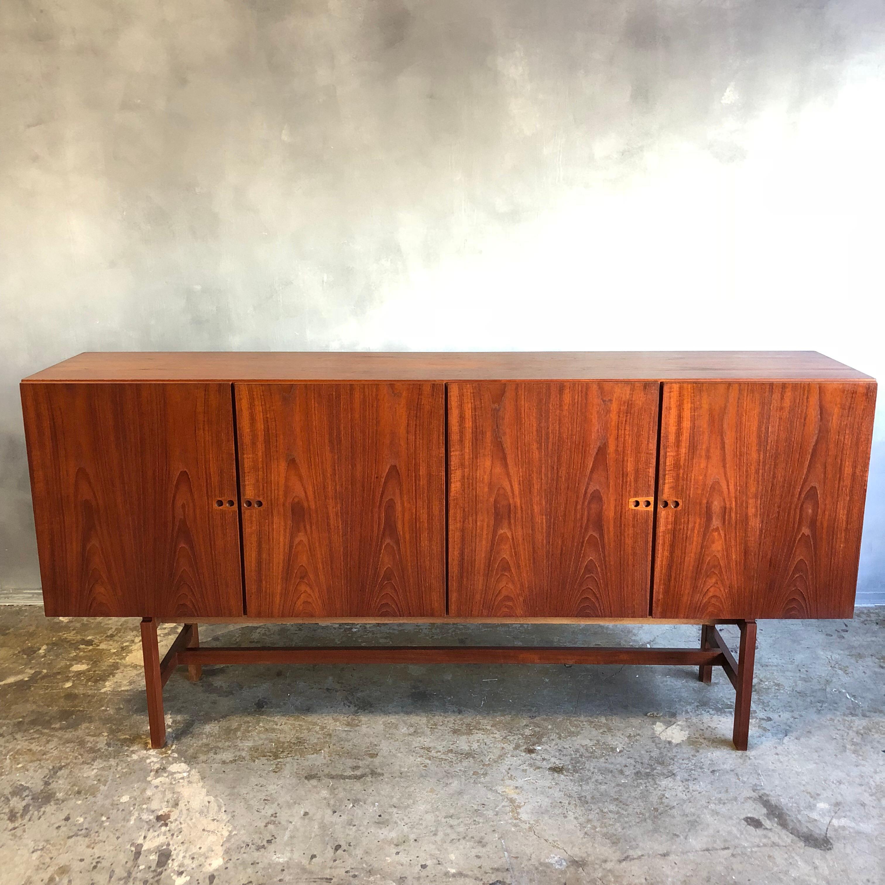 This credenza is simply beautiful. Very high quality construction with a finished teak wood back. It has a presence that doesn't come through in the pictures and in such good original condition that we never considered refinishing. Heirloom quality