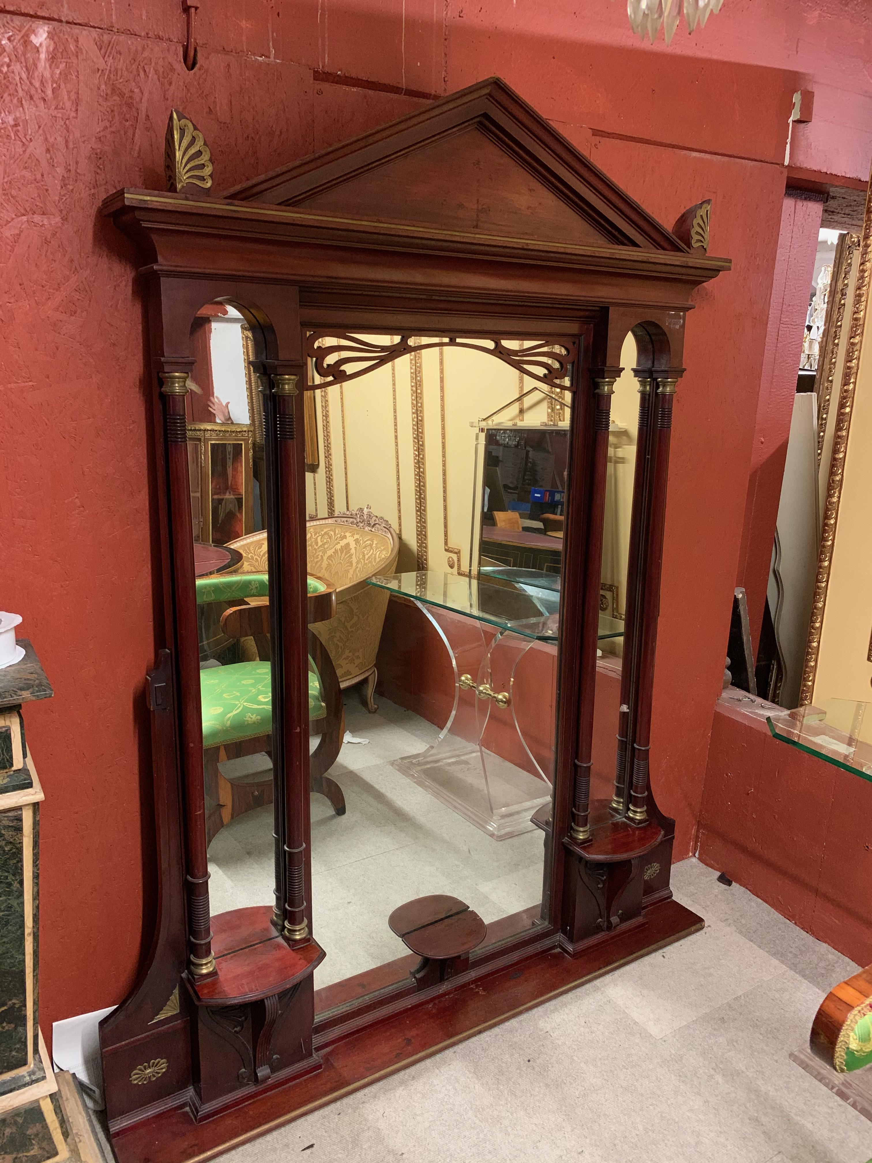 Monumental mirror in Empire style circa 1900 mahogany.
with 2 columns on each side.
 