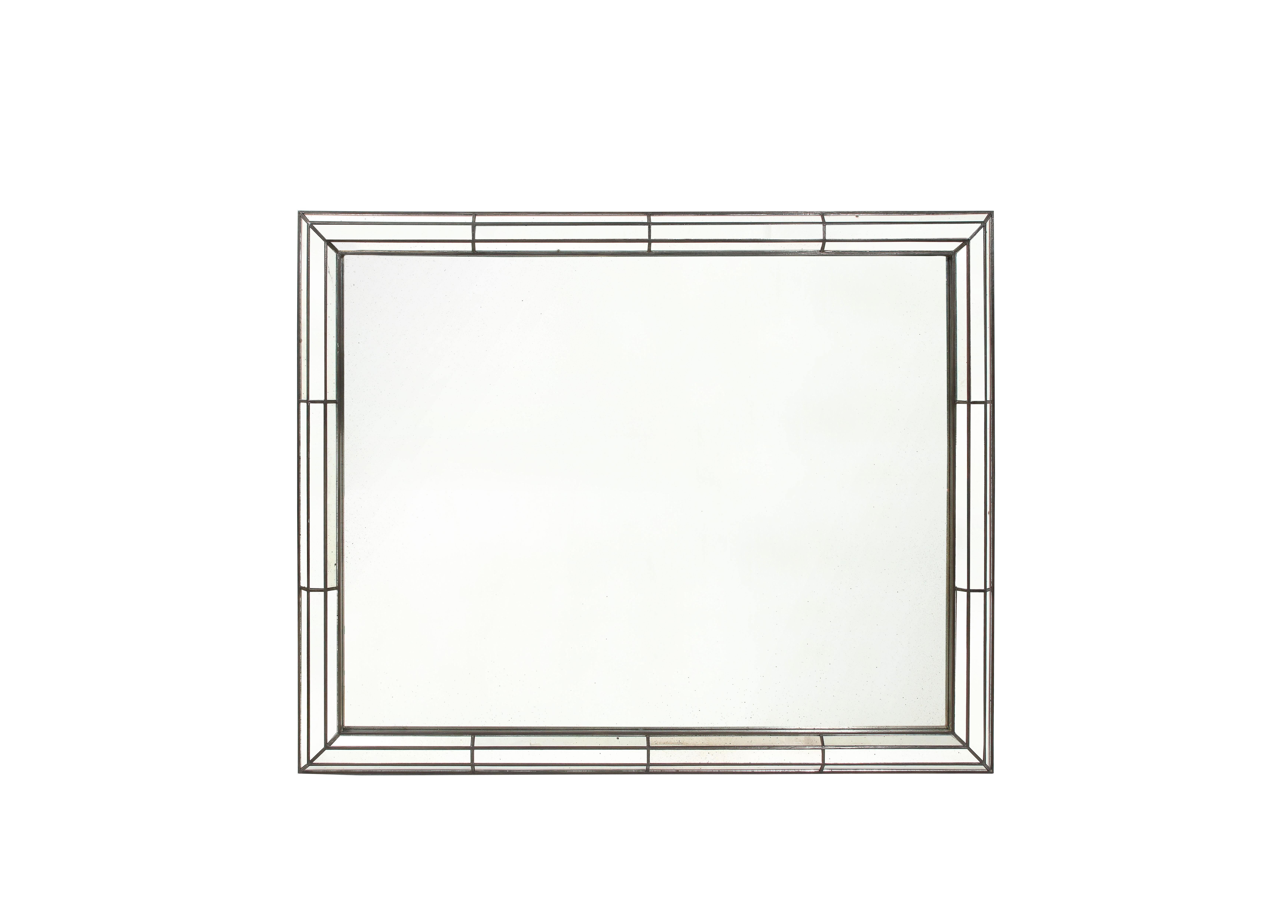 Custom fabricated rectangular with a three-section mirrored glass border surrounding a clear central mirror glass plate, the surrounding wood frame finished in silver metal leaf with a handsome dark patina.