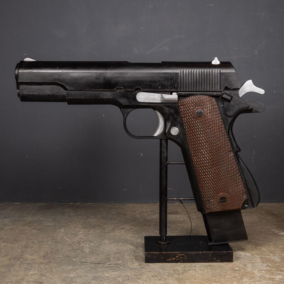 This enormous model of the M1911, standing over a meter tall, also known as the Colt 1911 or Colt Government for Colt-produced models, stands as an iconic firearm. This single-action, recoil-operated, semi-automatic pistol is chambered for the .45