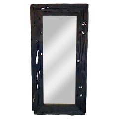 Miroir de sol en bois sculpté à la main avec cadre noir The Moderns