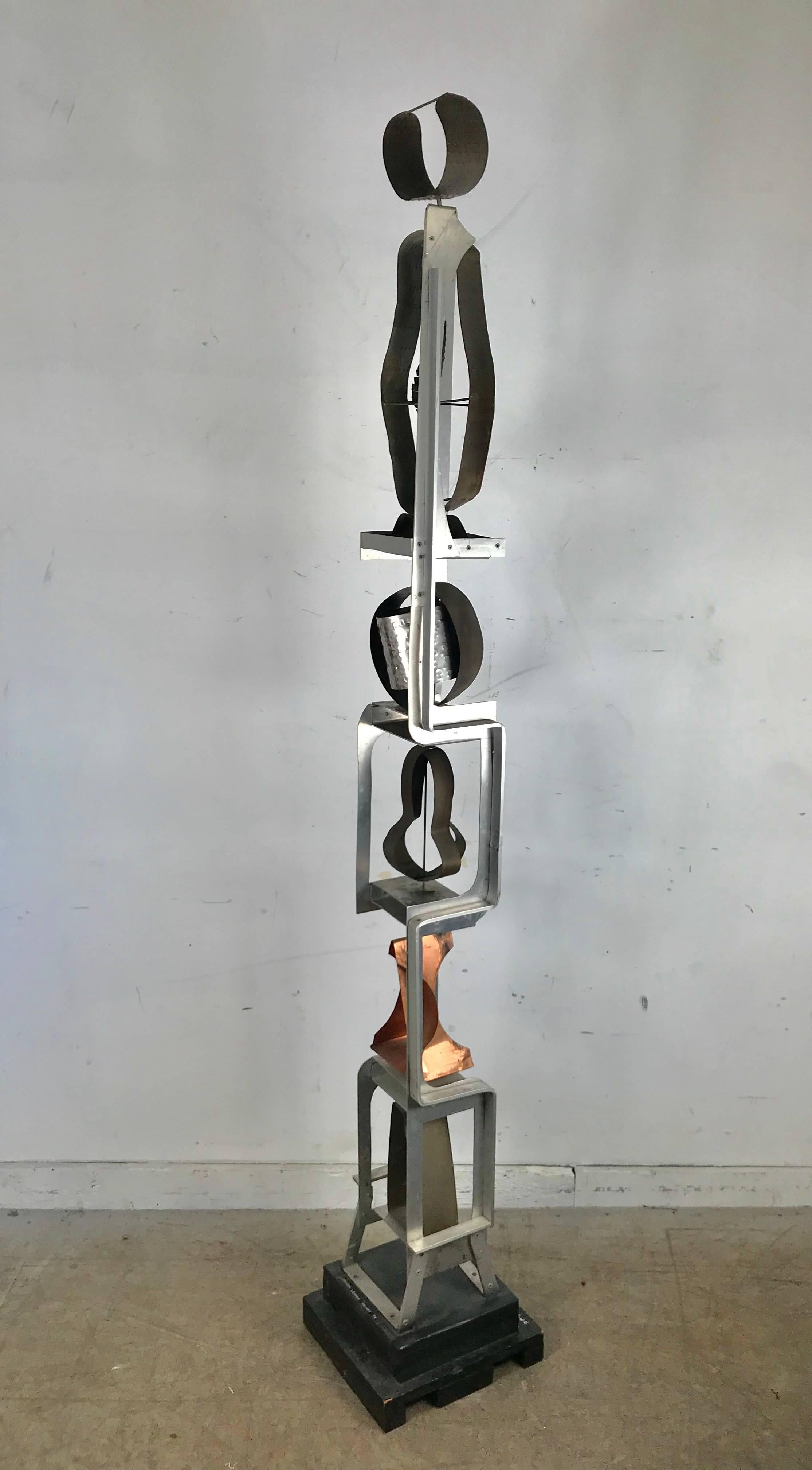 Titled Galaxy 79, which I believe to be the year? Amazing mixed metal sculpture, consisting of copper, brass, aluminum steel and wood. Aluminum frame consisting of five moving abstract sculptures, retains original label, Irving Lehman (1900-1983)