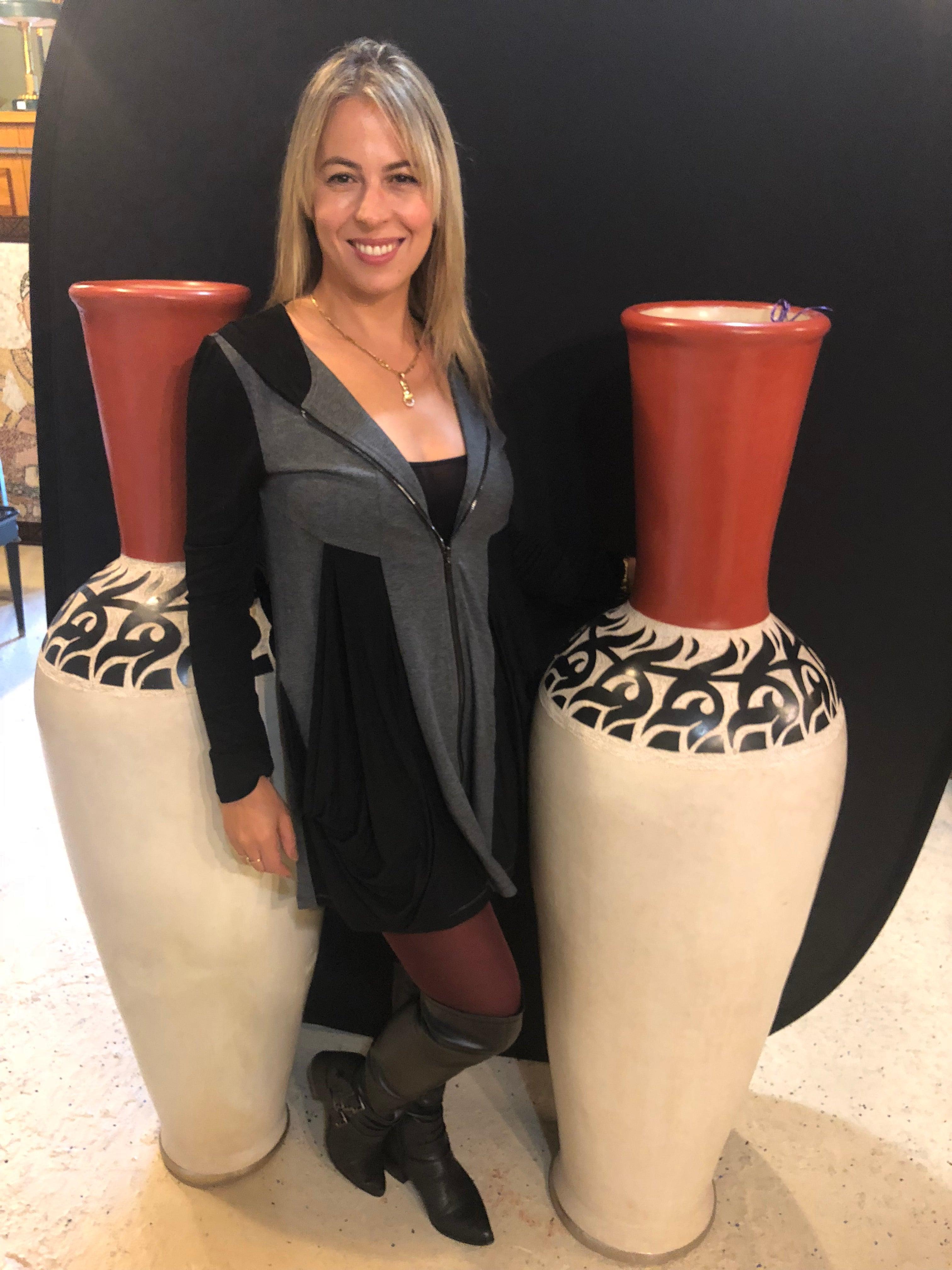 Monumental Moroccan pottery vase or urn handmade in red and white, a pair

Pair of monumental decorative Moroccan pottery vase or urns. Exceptionally decorative and beautiful are these tall vases in earthy red, off-white with decorative motifs in