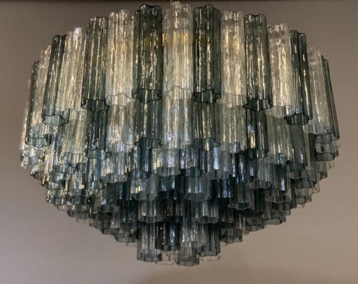 Superb glass chandelier composed of hand blown Murano glass elements colored in dark grey and clear alternated on brass-plated metal frame in 6 tiers. Fully restored and will be wired for the American market unless otherwise requested. All glass is