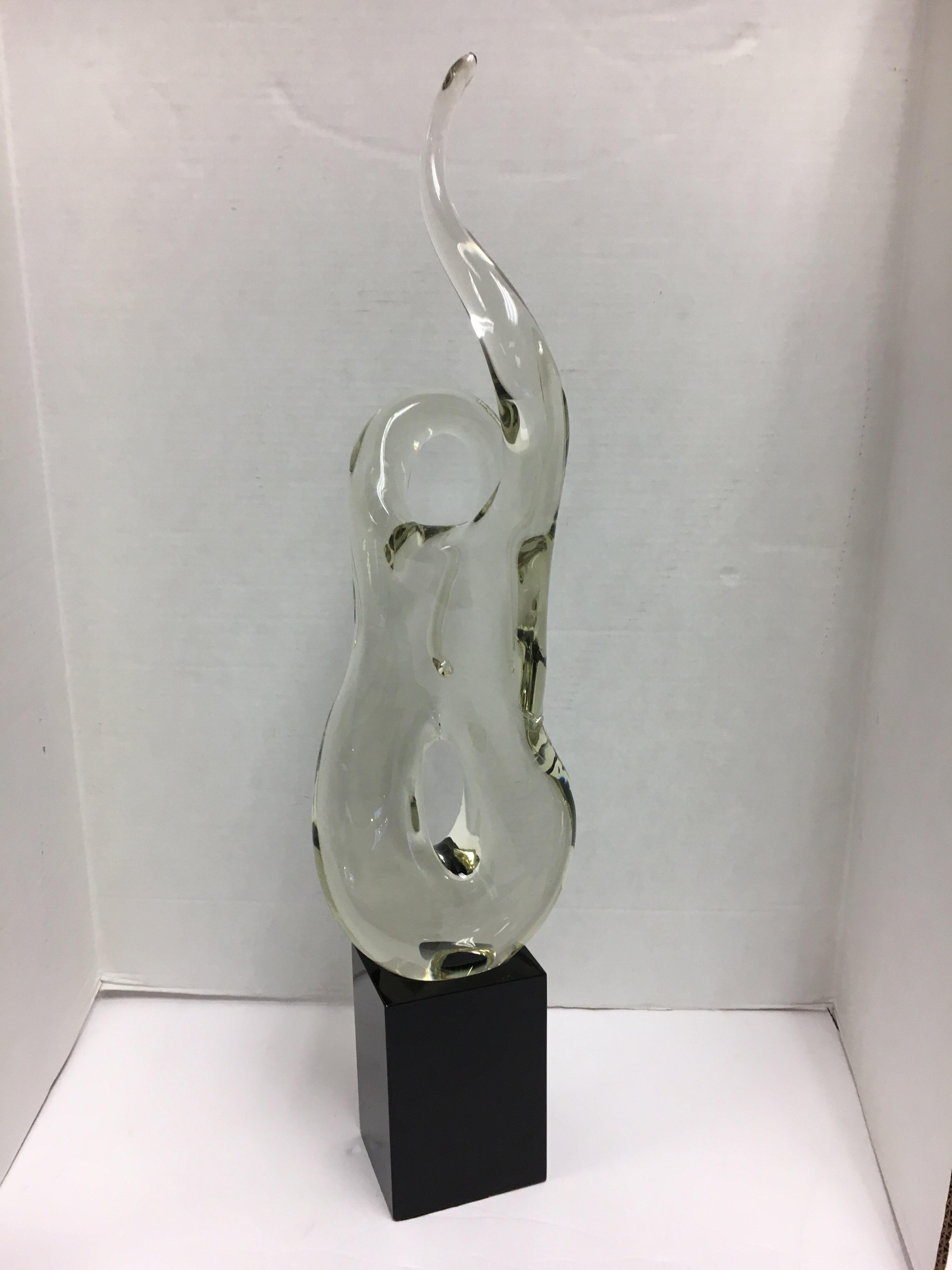 Sitting on a black resin base, this large twisted Murano glass sculpture is a sight to behold. The condition of the sculpture is perfect and it reflects light beautifully. The scale is perfect, not too big, but not too small. Signatures are hard to
