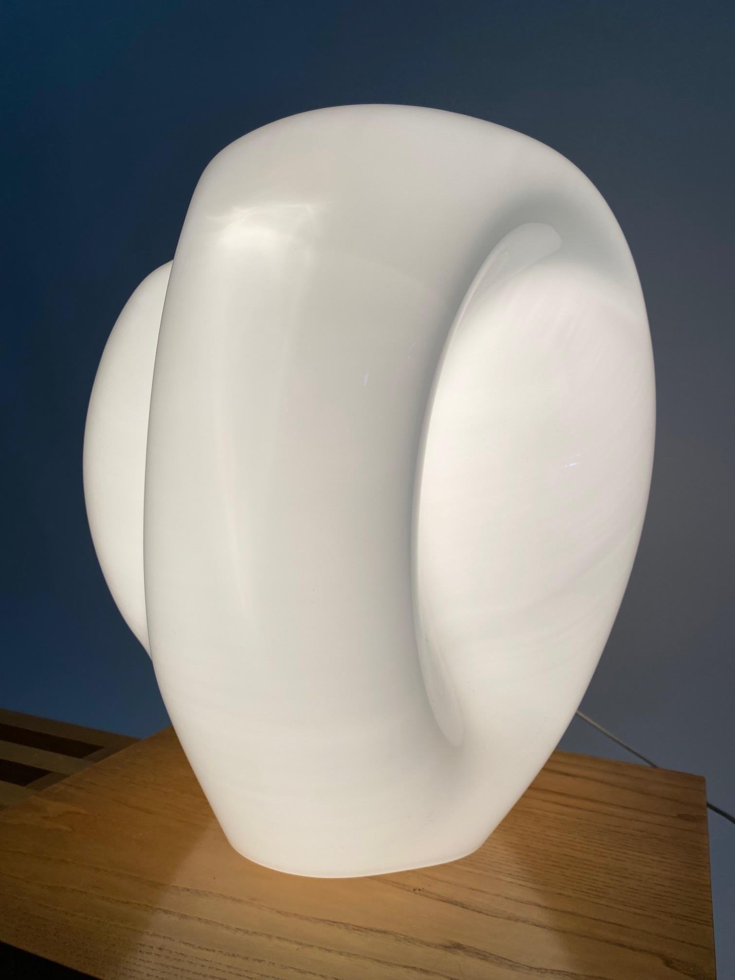Monumental table lamp in white Murano glass, attributable to the great Italian designer Carlo Nason. 

It is a sculptural object, of great visual impact, capable of giving prestige and refinement to the domestic environment