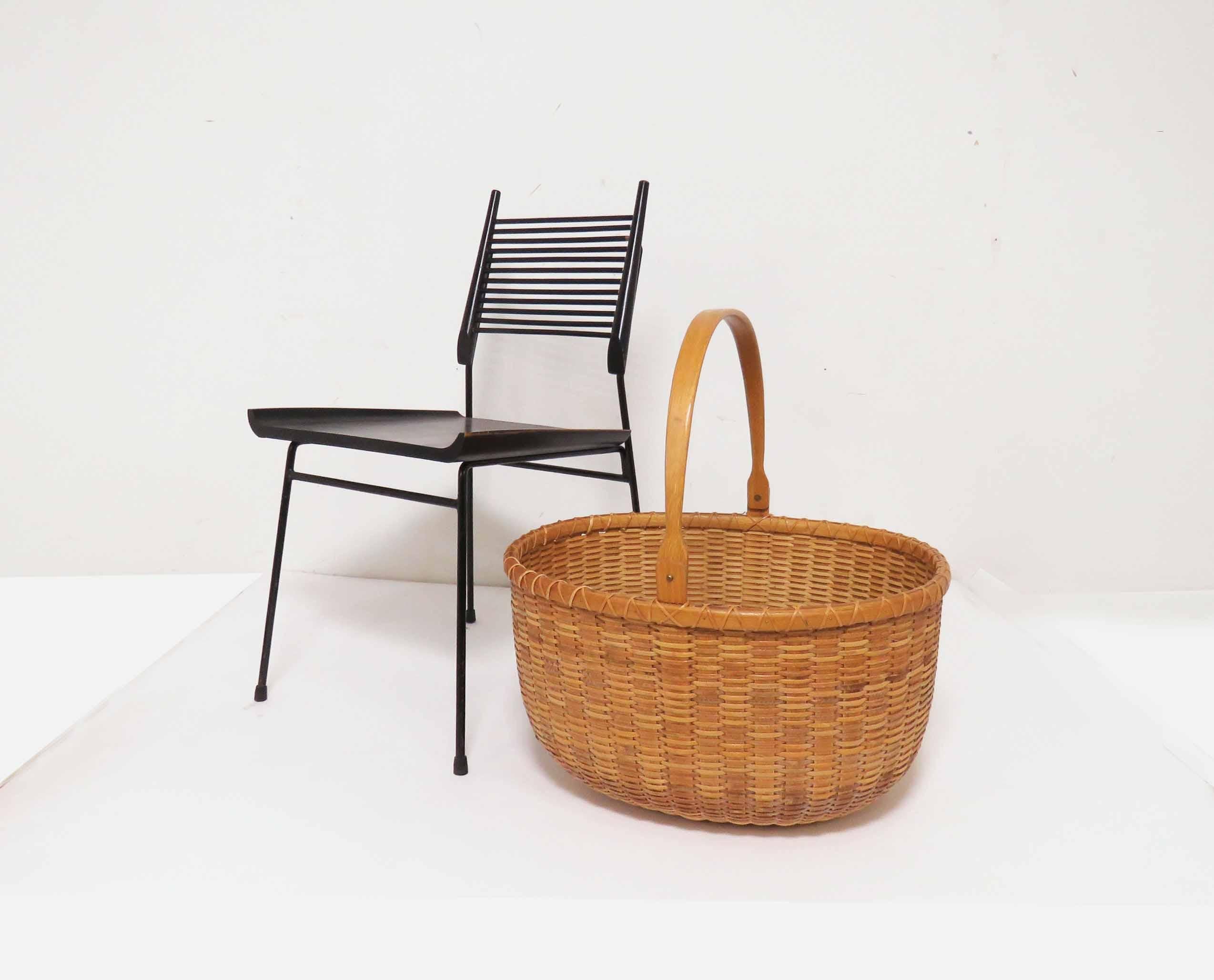 Unusually large Nantucket lightship basket with hand carved oak handle and base made by Arthur R. Martin, dated 1992. The oval basket measures 23