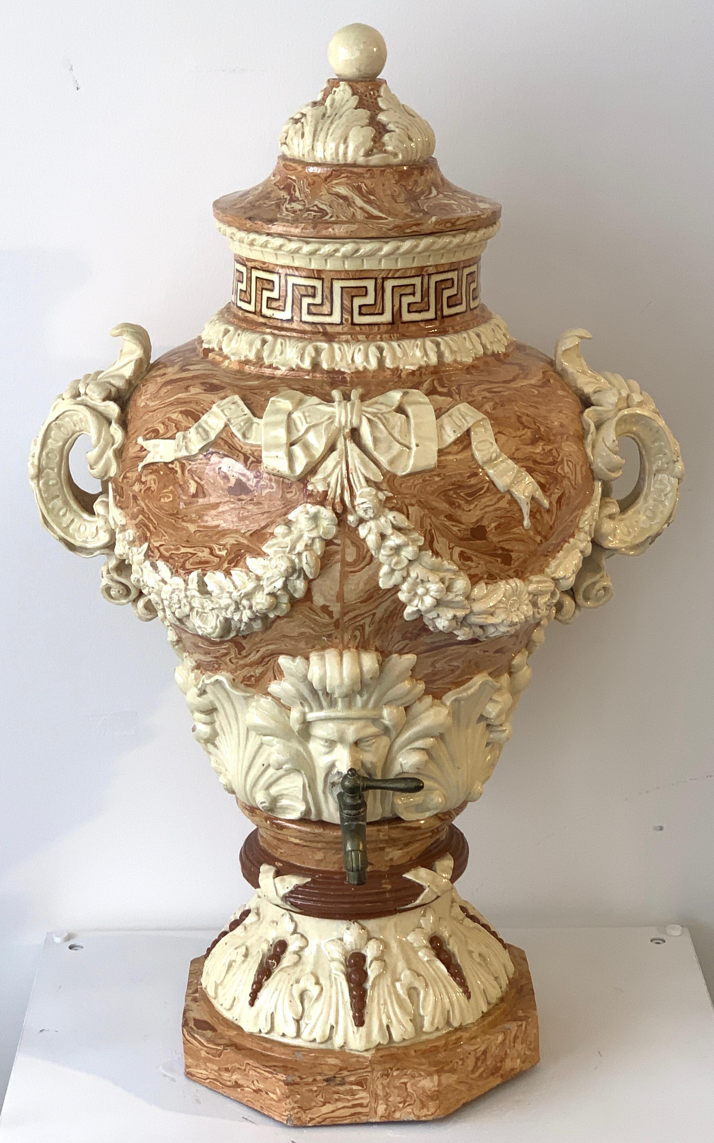 Monumental neoclassical aptware/mixed earth lavabo wine urn, a tour-de-force example of 19th century ceramics. Complete with the removable lid, the neck with Greek Key border, the body with large pierced handles. The urn is unmarked, except for the