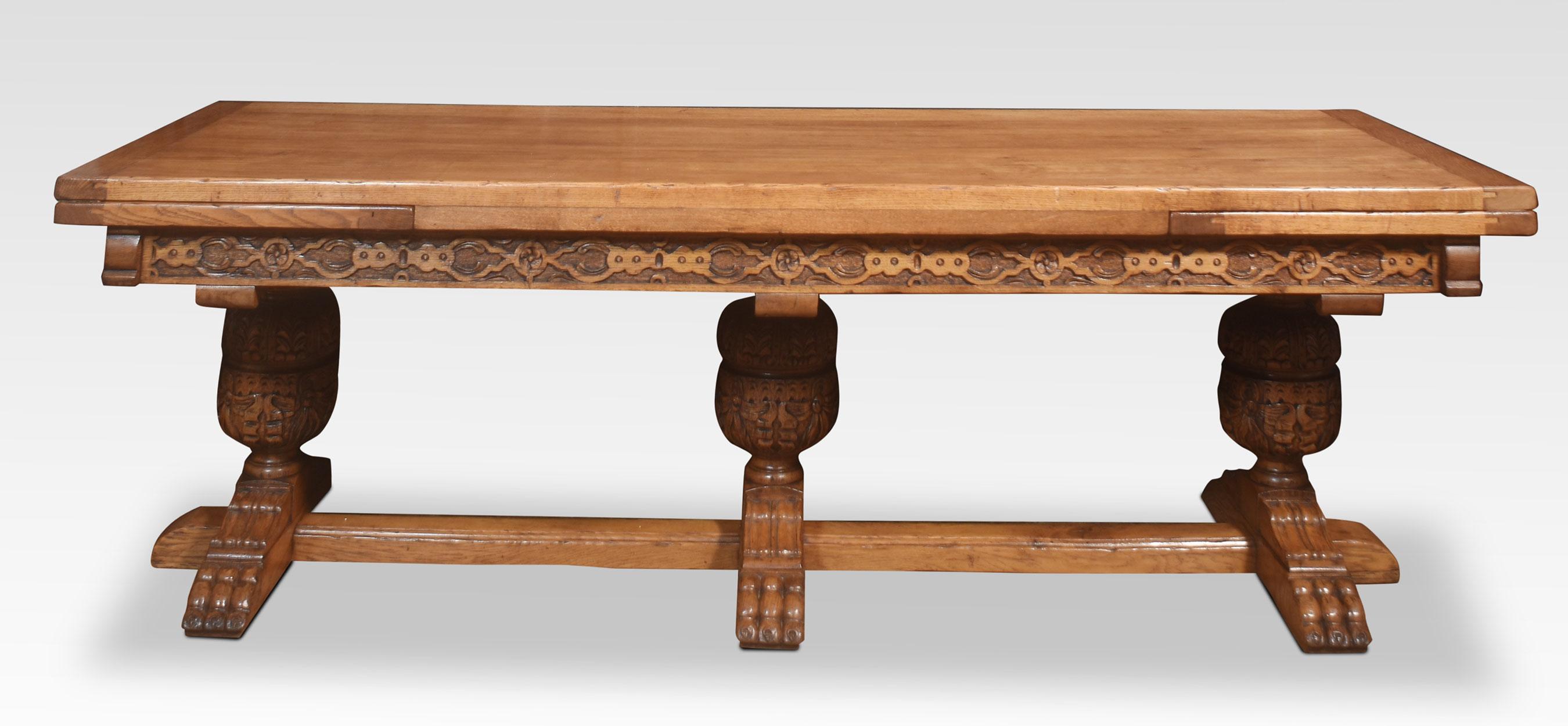 Very large oak refectory table the thick solid oak top and pull-out ends above carved freeze supported on three bulbous cup & cover legs leading down to paw feet united by stretchers.
Dimensions
Height 30 Inches
Width 96 Inches when open 144