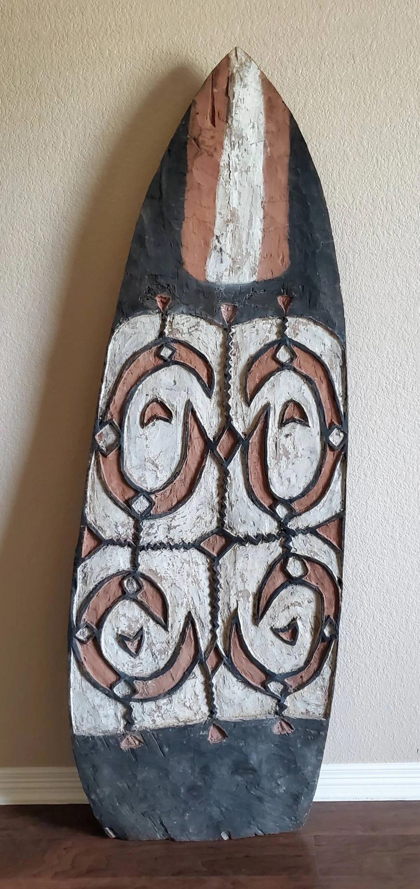 Tribal Monumental Oceanic Asmat People Carved Painted Wooden War Shield For Sale