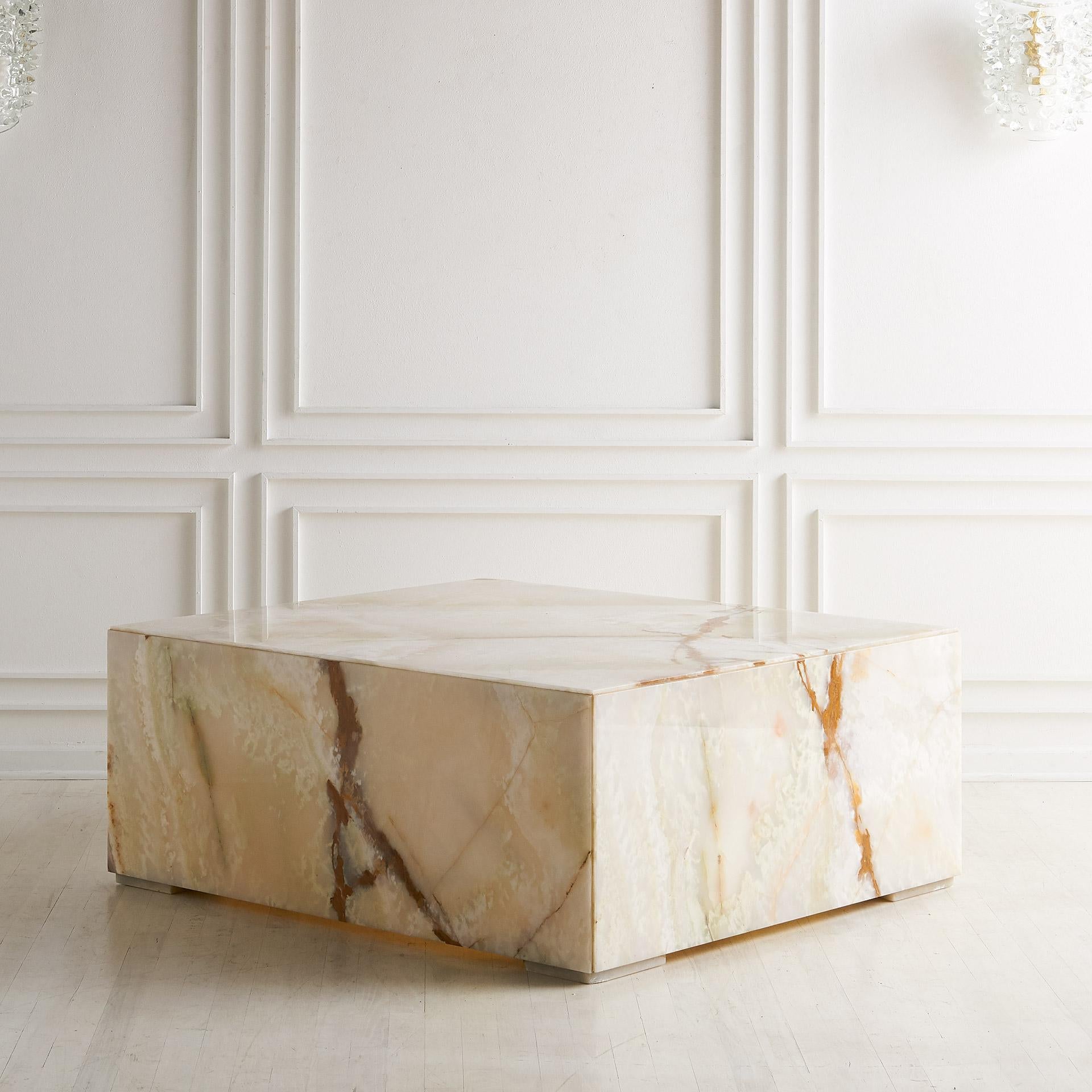 A stunning and large scale custom made Italian onyx coffee table. Origination from the collection of African American publishing pioneers, John and Eunice Johnson, who published the magazines Ebony and Jet. This table was custom made for the common