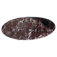 Mesa de centro ovalada Monumental de mármol Rosso Levanto pulido