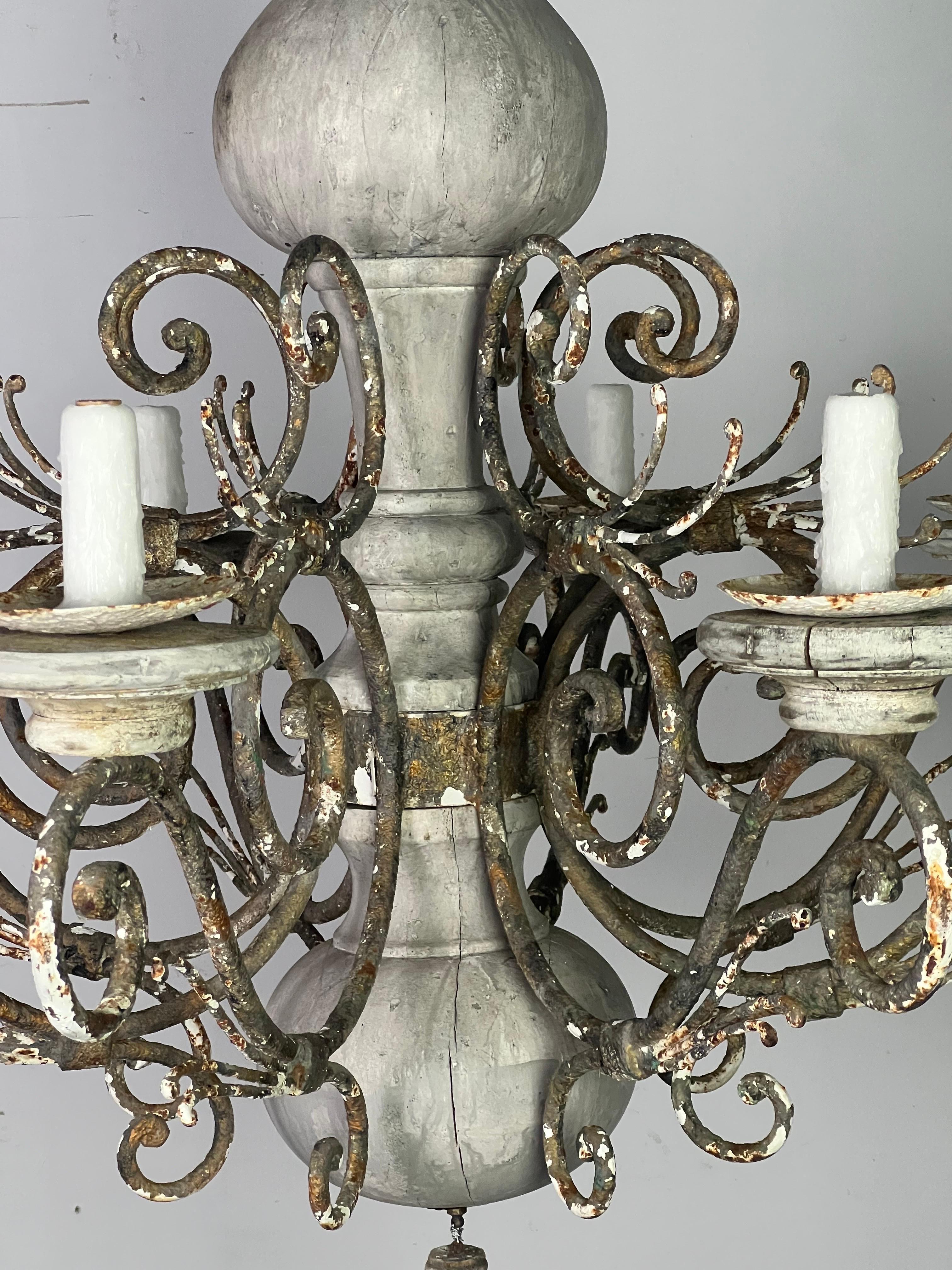 Monumental size eight light wood & iron chandelier. The chandelier is painted a dove gray coloration. The iron has developed a beautiful patina. The fixture is newly rewired and includes chain & canopy.
