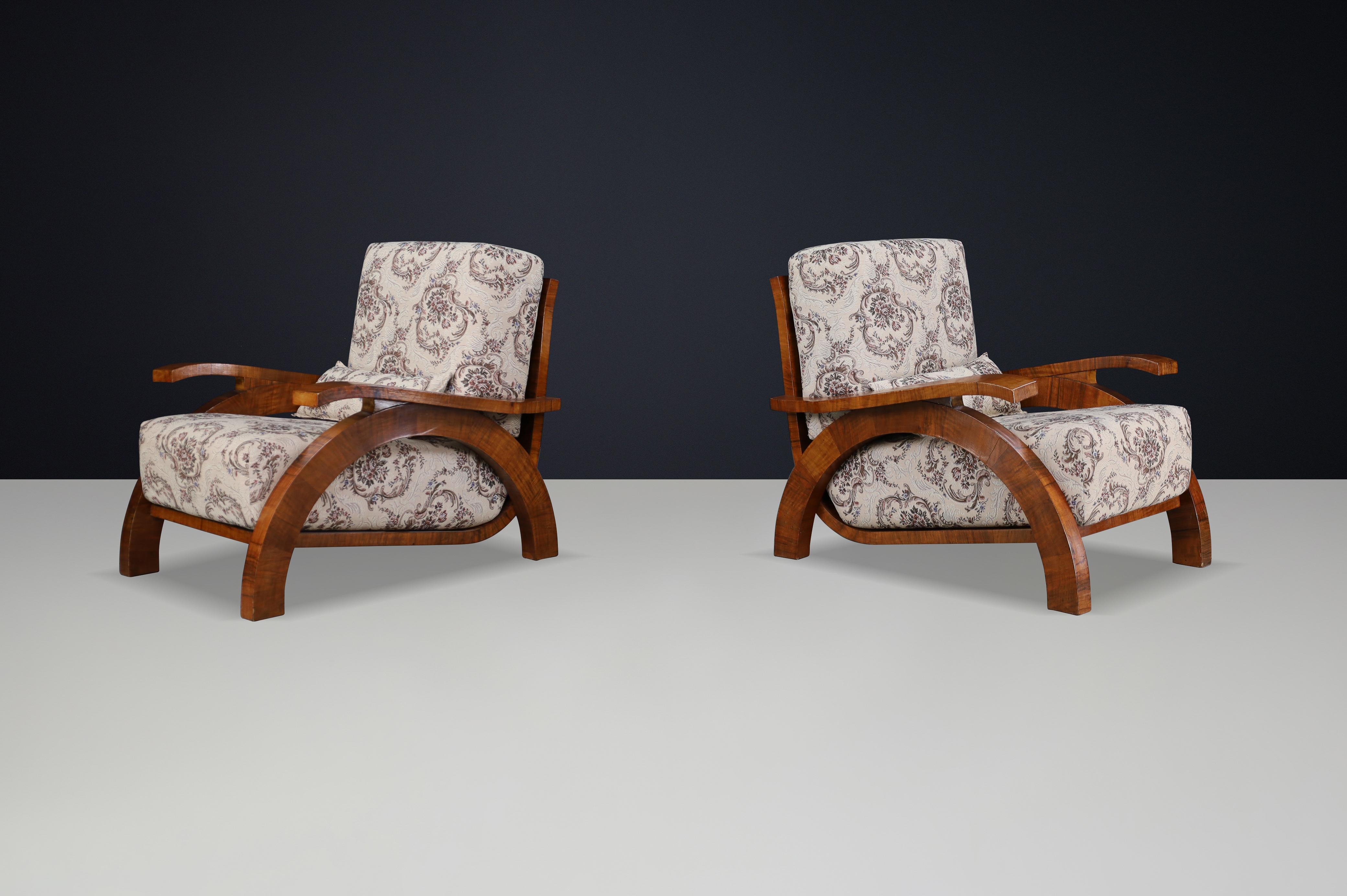 Monumental Pair of 1930s Czech Art Deco Lounge Chairs in Walnut, Expertly Reupholstered

A stunning pair of monumental Art Deco lounge chairs from 1930s Czechoslovakia, fully restored and newly reupholstered to showcase their timeless design and
