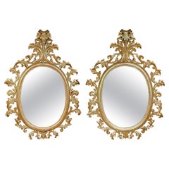Monumental Pair of 19th Century Oval Florentine Carved Giltwood Mirrors